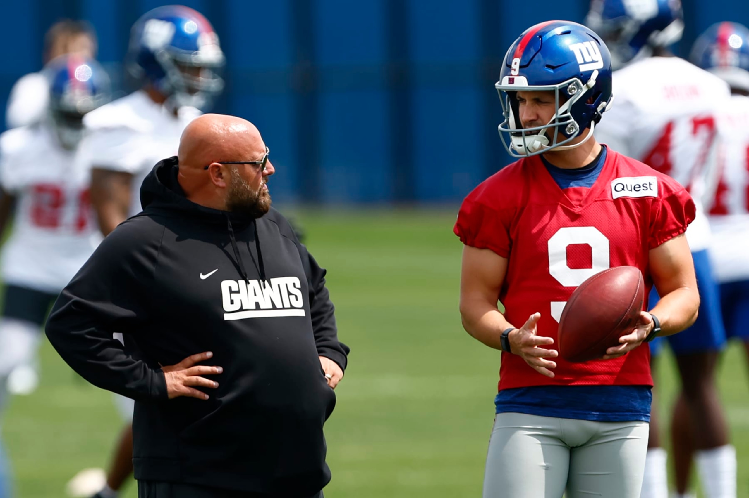 EAST RUTHERFORD, NEW JERSEY - JUNE 14: Head coach Brian Daboll of the New York Giants talks with quarterback Jacob Eason #9 during the teams mini camp at Quest Training Center on June 14, 2023 in East Rutherford, New Jersey. (Photo by Rich Schultz/Getty Images)