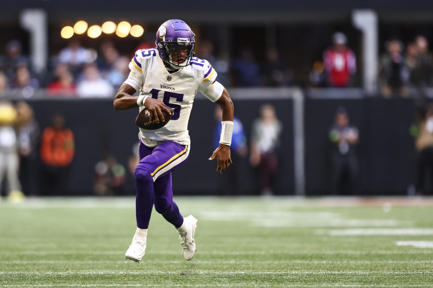 ATLANTA, GA - NOVEMBER 5: Joshua Dobbs #15 of the Minnesota Vikings carries the ball during the third quarter of an NFL football game against the Atlanta Falcons at Mercedes-Benz Stadium on November 5, 2023 in Atlanta, Georgia. (Photo by Kevin Sabitus/Getty Images)