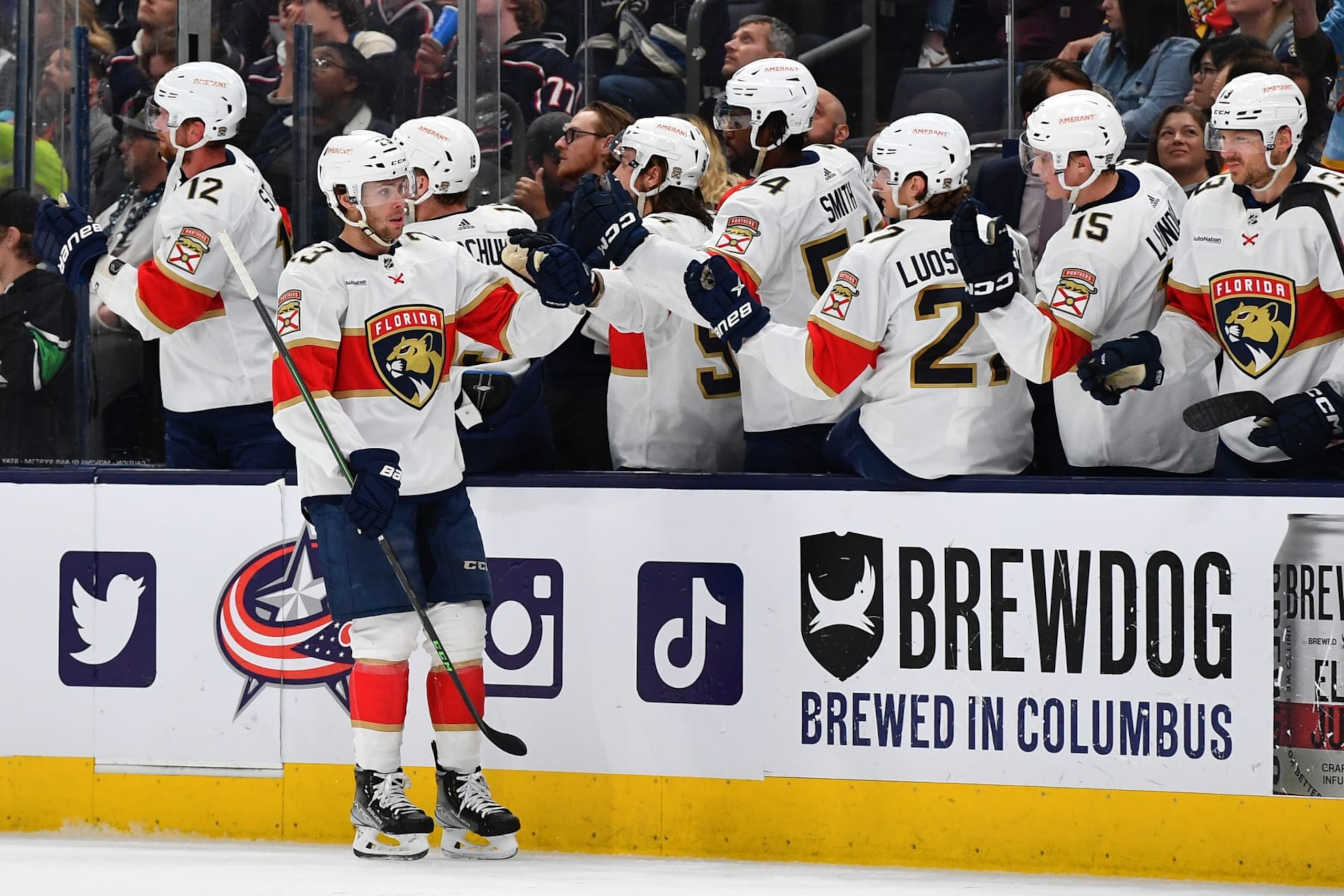 COLUMBUS, OHIO - APRIL 1: Carter Verhaeghe #23 of the Florida Panthers high-fives his teammates after scoring a goal during the first period of a game against the Columbus Blue Jackets at Nationwide Arena on April 1, 2023 in Columbus, Ohio. (Photo by Ben Jackson/NHLI via Getty Images)