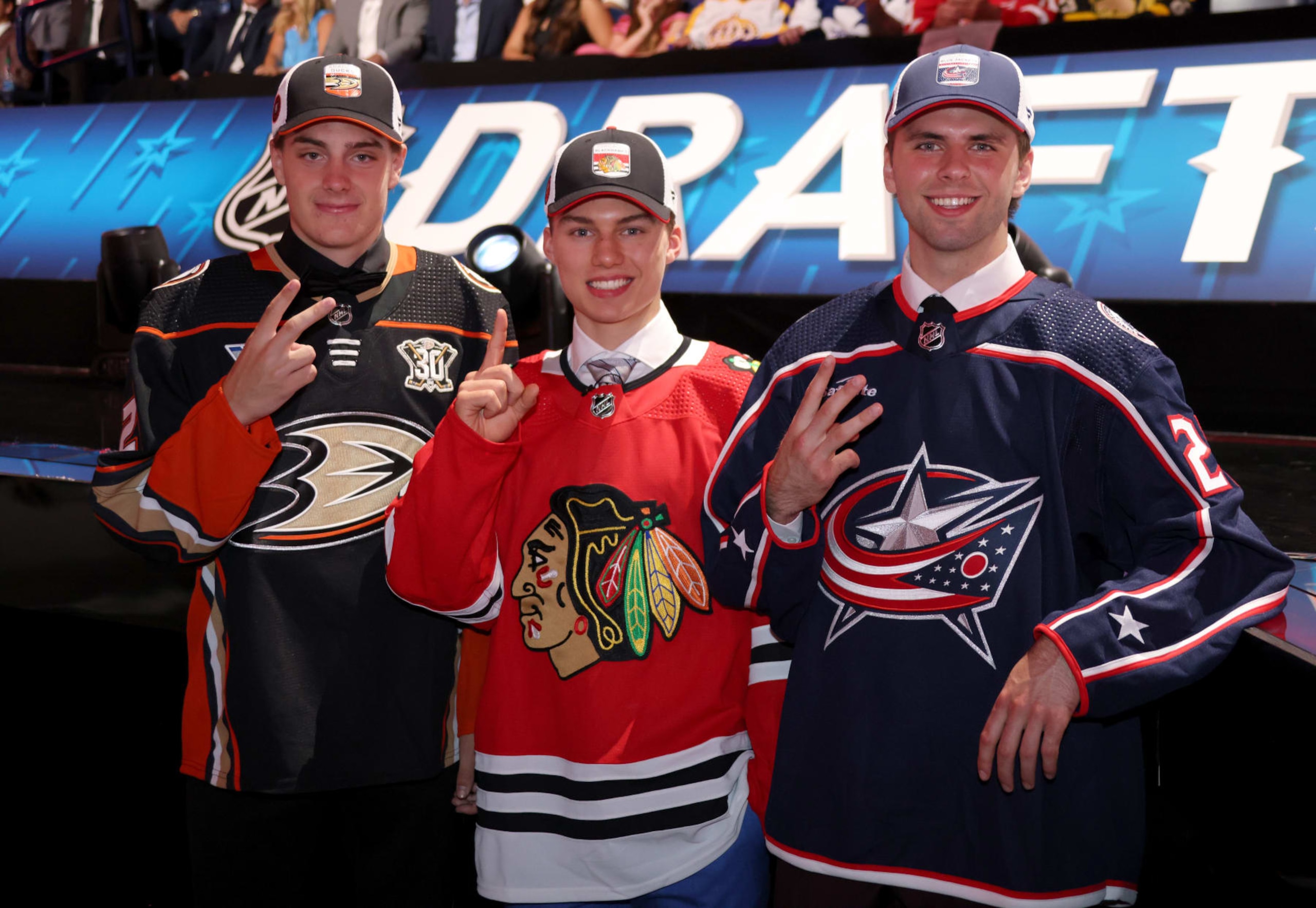 NASHVILLE, TENNESSEE - JUNE 28: (L-R) Leo Carlsson, second overall pick by the Anaheim Ducks, Connor Bedard, first overall pick by the Chicago Blackhawks, and Adam Fantilli, third overall pick by the Columbus Blue Jackets, pose for a photo during the 2023 Upper Deck NHL Draft - Round One at Bridgestone Arena on June 28, 2023 in Nashville, Tennessee. (Photo by Dave Sandford/NHLI via Getty Images)