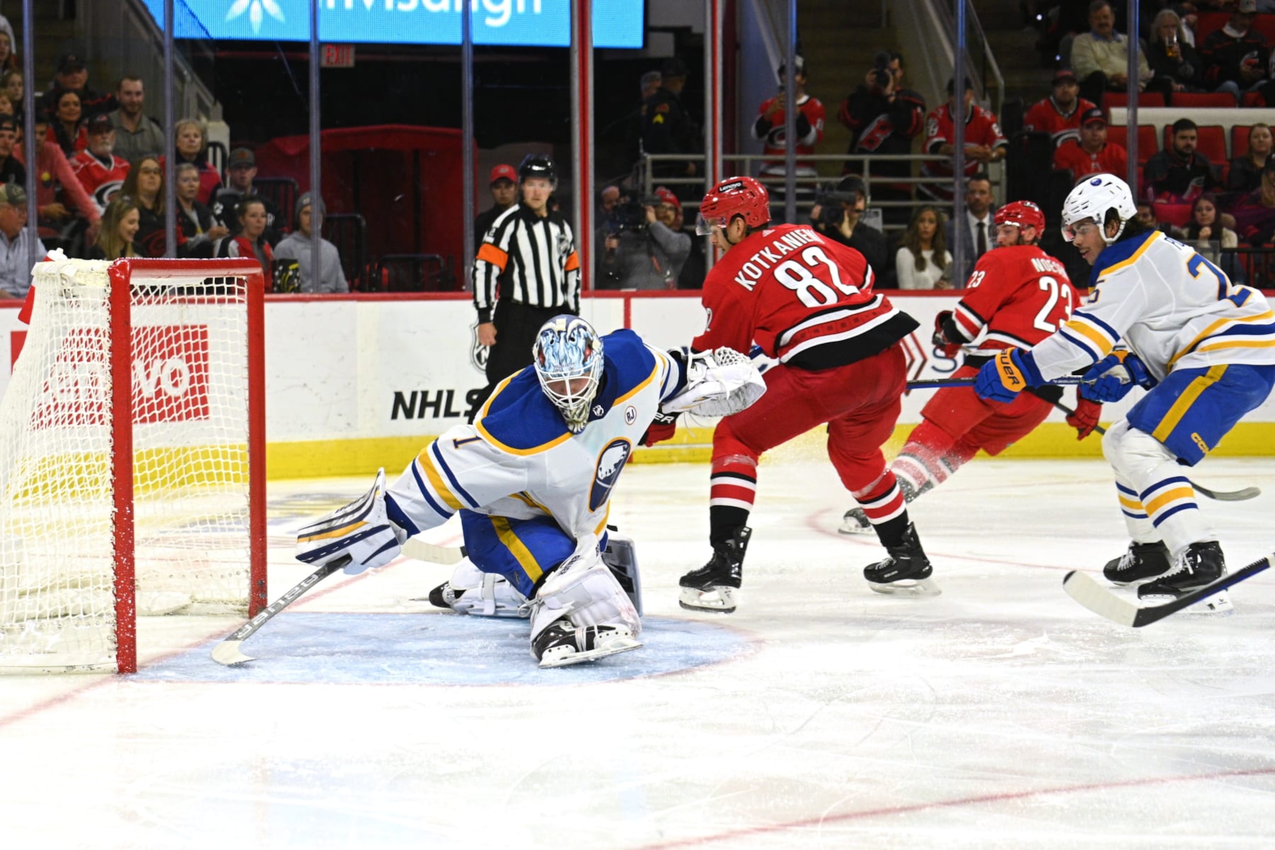 RALEIGH, NC - NOVEMBER 07: Buffalo Sabres Goalie Ukko-Pekka Luukkonen (1) stretches to deflect a shot from Carolina Hurricanes Center Jesperi Kotkaniemi (82) during the game between the Buffalo Sabres and the Carolina Hurricanes on November 7, 2023 at PNC Arena in Raleigh, North Carolina. (Photo by Katherine Gawlik/Icon Sportswire via Getty Images)