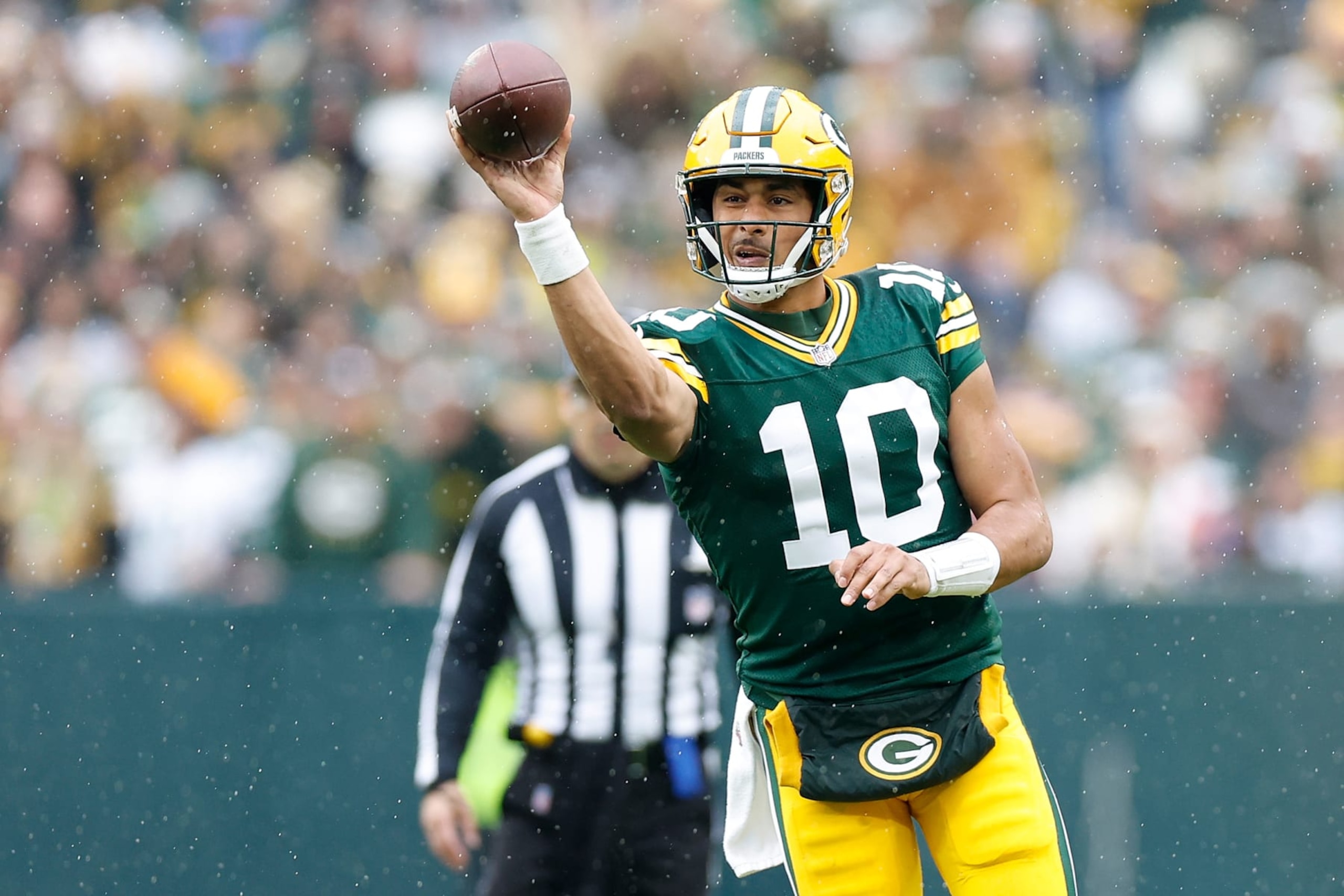 GREEN BAY, WISCONSIN - NOVEMBER 05: Jordan Love #10 of the Green Bay Packers throws a pass during the game against the Los Angeles Rams at Lambeau Field on November 05, 2023 in Green Bay, Wisconsin. (Photo by John Fisher/Getty Images)