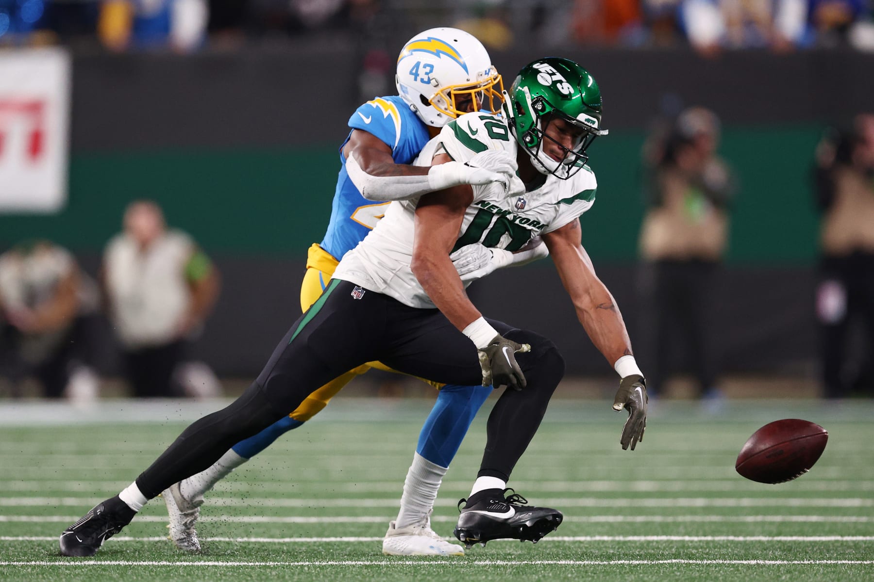 EAST RUTHERFORD, NEW JERSEY - NOVEMBER 06: Michael Davis #43 of the Los Angeles Chargers breaks up a pass intended for Allen Lazard #10 of the New York Jets during the first half at MetLife Stadium on November 06, 2023 in East Rutherford, New Jersey. (Photo by Elsa/Getty Images)