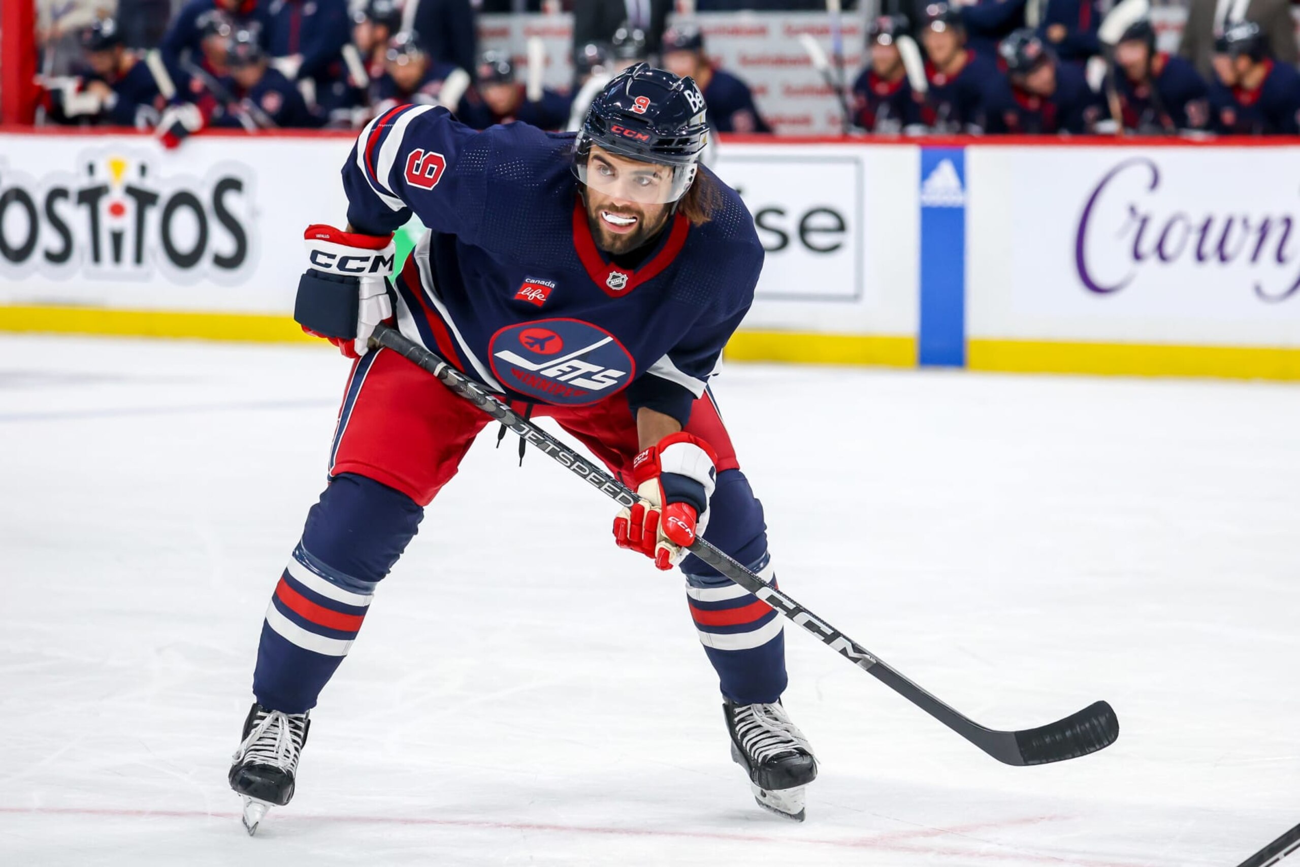 WINNIPEG, CANADA - OCTOBER 24: Alex Iafallo #9 of the Winnipeg Jets gets set during a second period face-off against the St. Louis Blues at the Canada Life Centre on October 24, 2023 in Winnipeg, Manitoba, Canada. (Photo by Jonathan Kozub/NHLI via Getty Images)