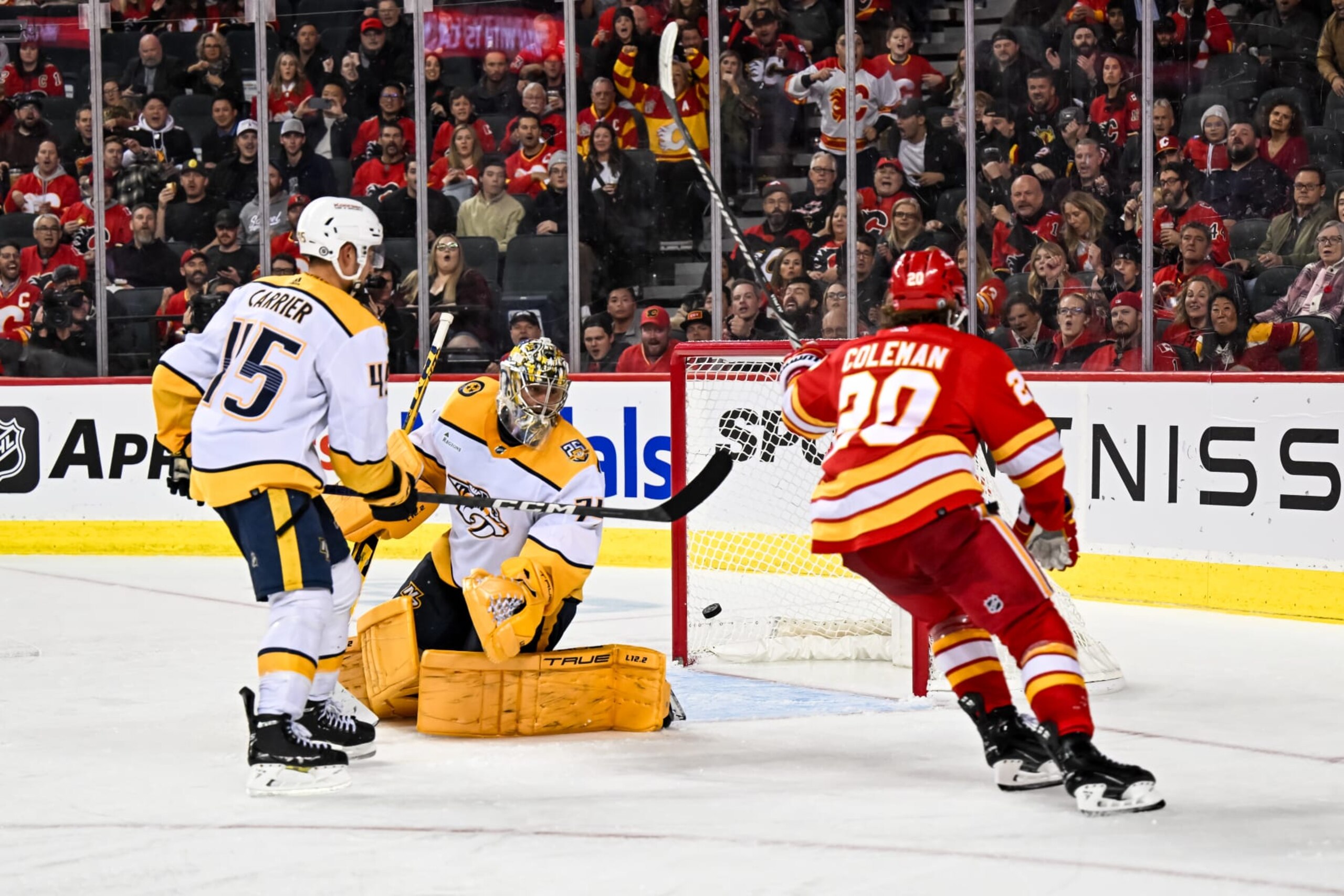 CALGARY, AB - NOVEMBER 07: Calgary Flames Right Wing Blake Coleman (20) scores a goal against Nashville Predators Goalie Juuse Saros (74) during the third period of an NHL game between the Calgary Flames and the Nashville Predators on November 7, 2023, at the Scotiabank Saddledome in Calgary, AB. (Photo by Brett Holmes/Icon Sportswire via Getty Images)
