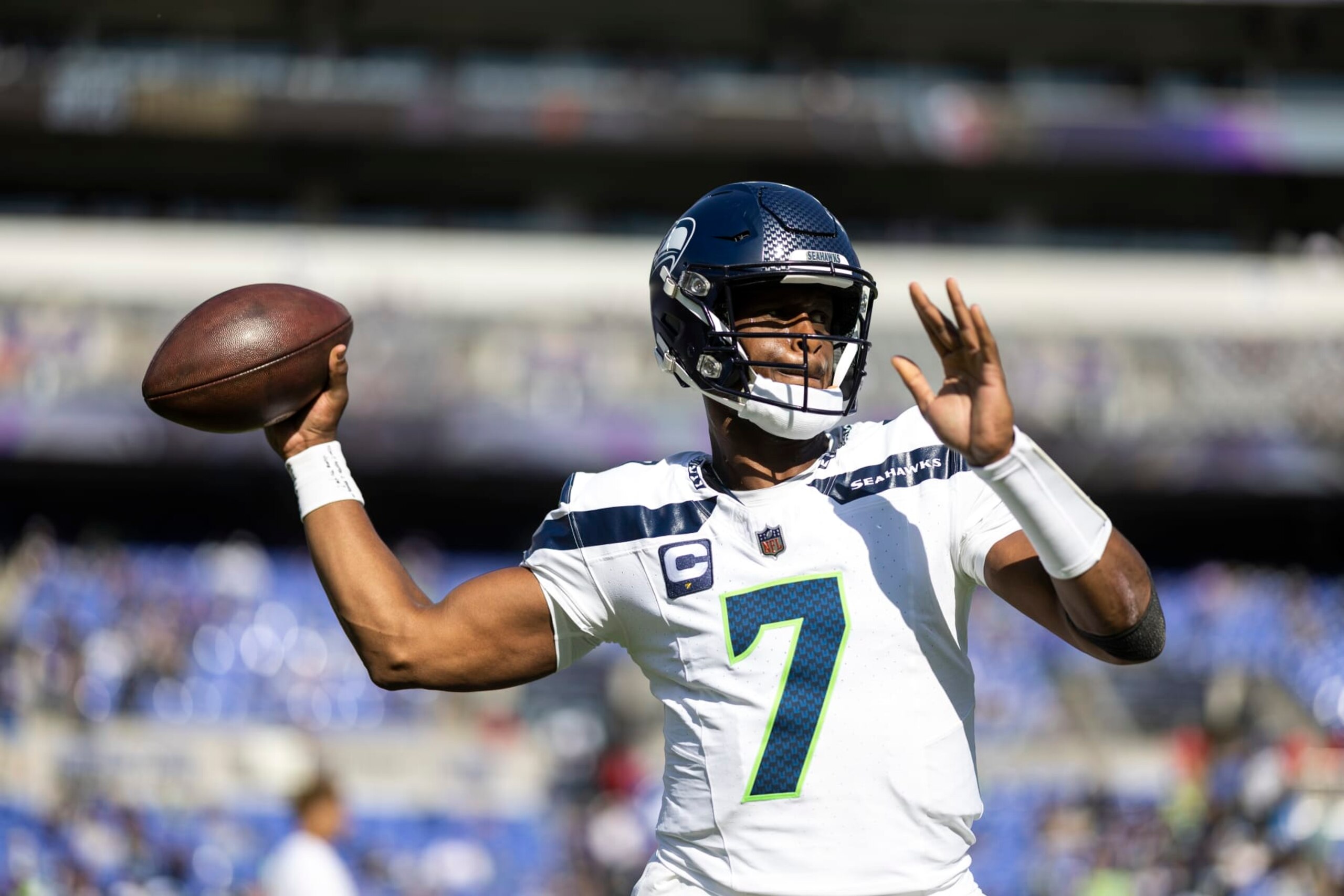 BALTIMORE, MARYLAND - NOVEMBER 05: Geno Smith #7 of the Seattle Seahawks throws a pass as he warms up prior to an NFL football game between the Baltimore Ravens and the Seattle Seahawks at M&T Bank Stadium on November 05, 2023 in Baltimore, Maryland. (Photo by Michael Owens/Getty Images)