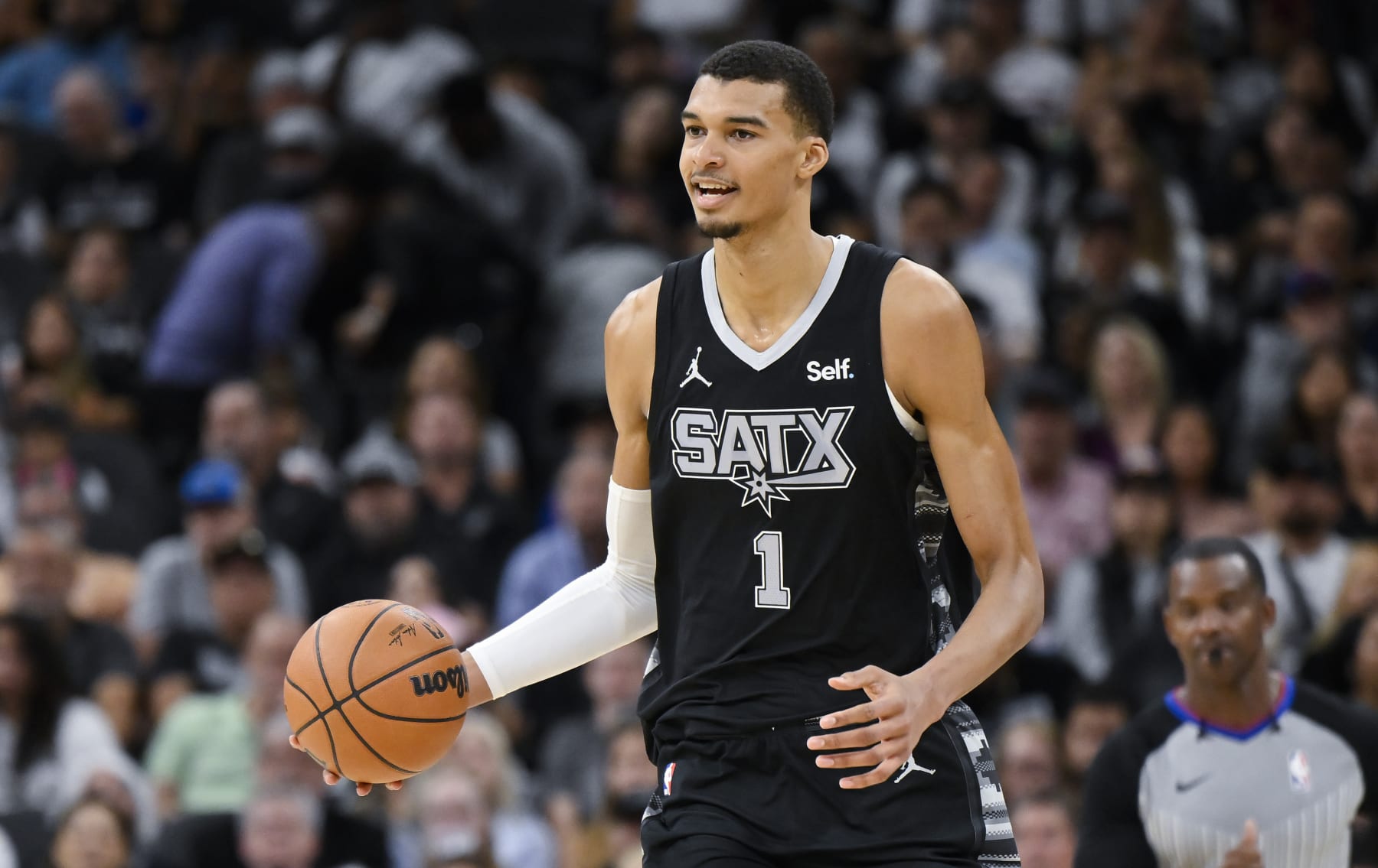San Antonio Spurs' Victor Wembanyama runs upcourt during the first half of an NBA basketball game against the Toronto Raptors, Sunday, Nov. 5, 2023, in San Antonio. (AP Photo/Darren Abate)