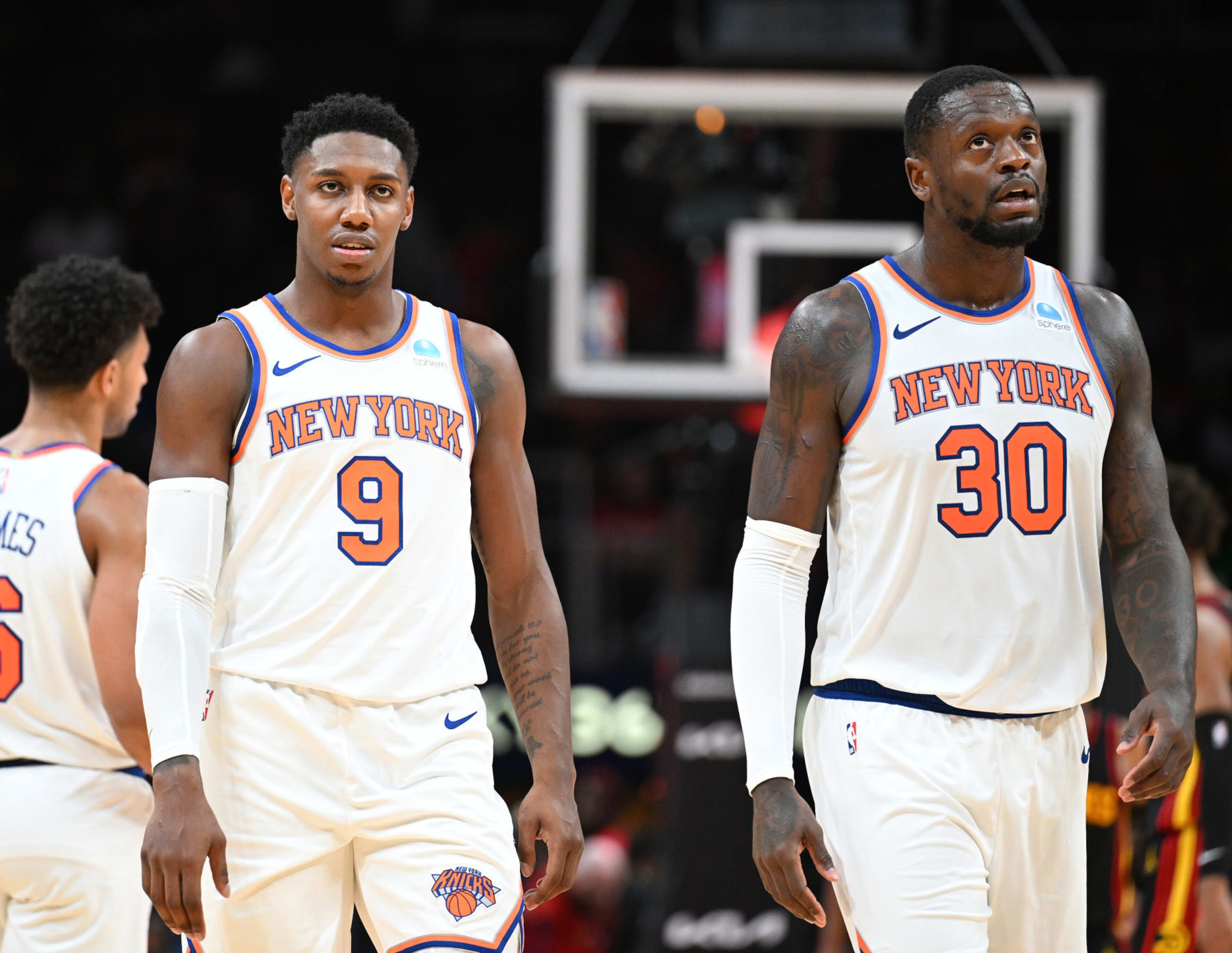 ATLANTA, GA - OCTOBER 27: RJ Barrett #9 and Julius Randle #30 of the New York Knicks look on during the game against the Atlanta Hawks on October 27, 2023 at State Farm Arena in Atlanta, Georgia. NOTE TO USER: User expressly acknowledges and agrees that, by downloading and/or using this Photograph, user is consenting to the terms and conditions of the Getty Images License Agreement. Mandatory Copyright Notice: Copyright 2023 NBAE (Photo by Adam Hagy/NBAE via Getty Images) ATLANTA, GA - OCTOBER 27: RJ Barrett #9 and Julius Randle #30 of the New York Knicks look on during the game against the Atlanta Hawks on October 27, 2023 at State Farm Arena in Atlanta, Georgia. NOTE TO USER: User expressly acknowledges and agrees that, by downloading and/or using this Photograph, user is consenting to the terms and conditions of the Getty Images License Agreement. Mandatory Copyright Notice: Copyright 2023 NBAE (Photo by Adam Hagy/NBAE via Getty Images)