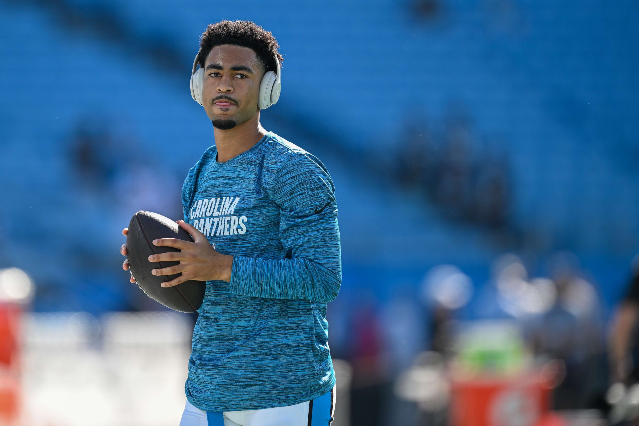 CHARLOTTE, NORTH CAROLINA - OCTOBER 29: Bryce Young #9 of the Carolina Panthers wears Beats headphones as he warms up during the game against the Houston Texans at Bank of America Stadium on October 29, 2023 in Charlotte, North Carolina. (Photo by Grant Halverson/Getty Images)