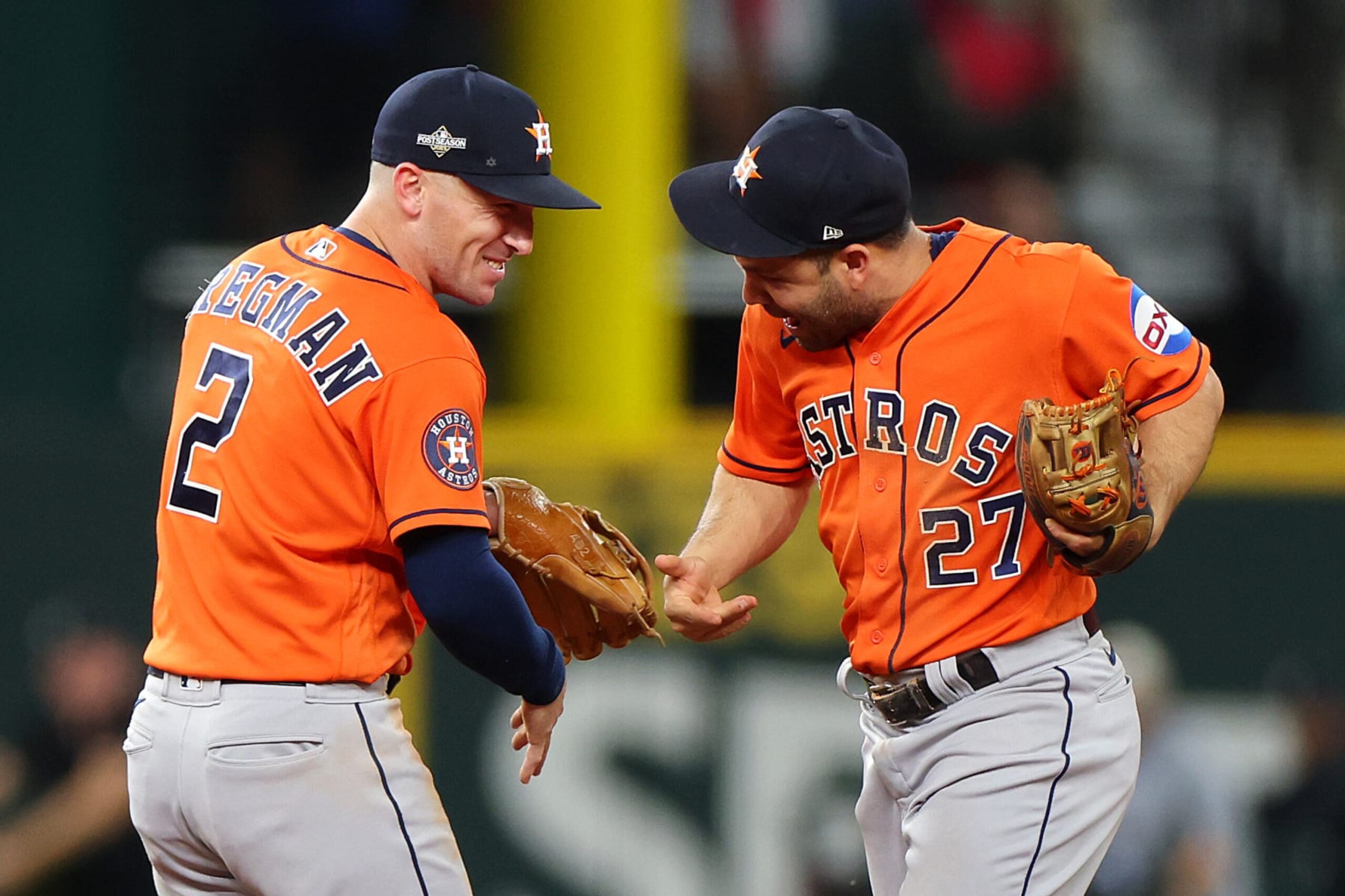 ARLINGTON, TEXAS - OCTOBER 20: Jose Altuve #27 of the Houston Astros celebrates with Alex Bregman #2 after defeating the Texas Rangers in Game Five of the American League Championship Series at Globe Life Field on October 20, 2023 in Arlington, Texas. (Photo by Stacy Revere/Getty Images)