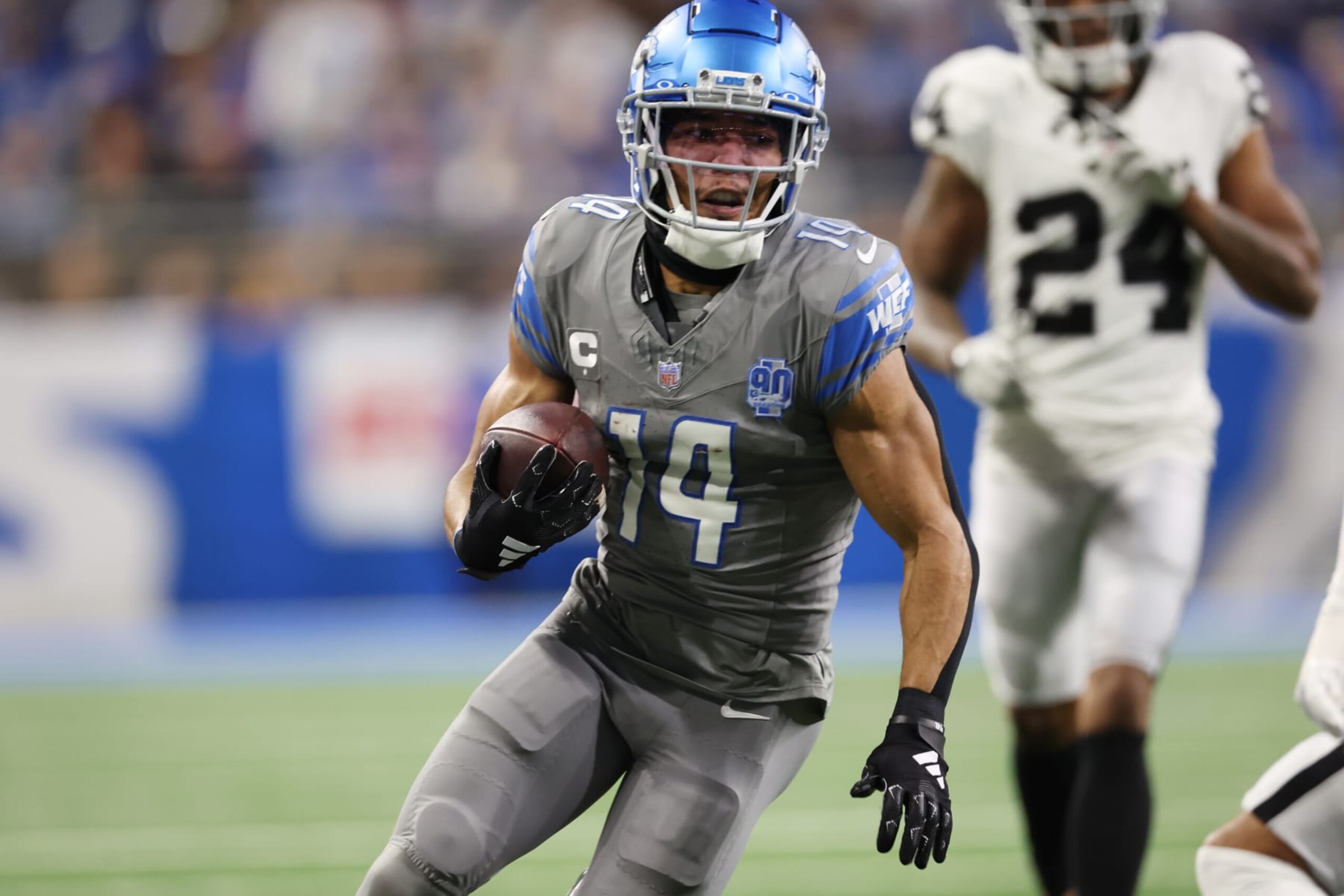DETROIT, MICHIGAN - OCTOBER 30: Amon-Ra St. Brown #14 of the Detroit Lions carries a pass completion in the first half against the Las Vegas Raiders at Ford Field on October 30, 2023 in Detroit, Michigan. (Photo by Gregory Shamus/Getty Images) DETROIT, MICHIGAN - OCTOBER 30: Amon-Ra St. Brown #14 of the Detroit Lions carries a pass completion in the first half against the Las Vegas Raiders at Ford Field on October 30, 2023 in Detroit, Michigan. (Photo by Gregory Shamus/Getty Images)