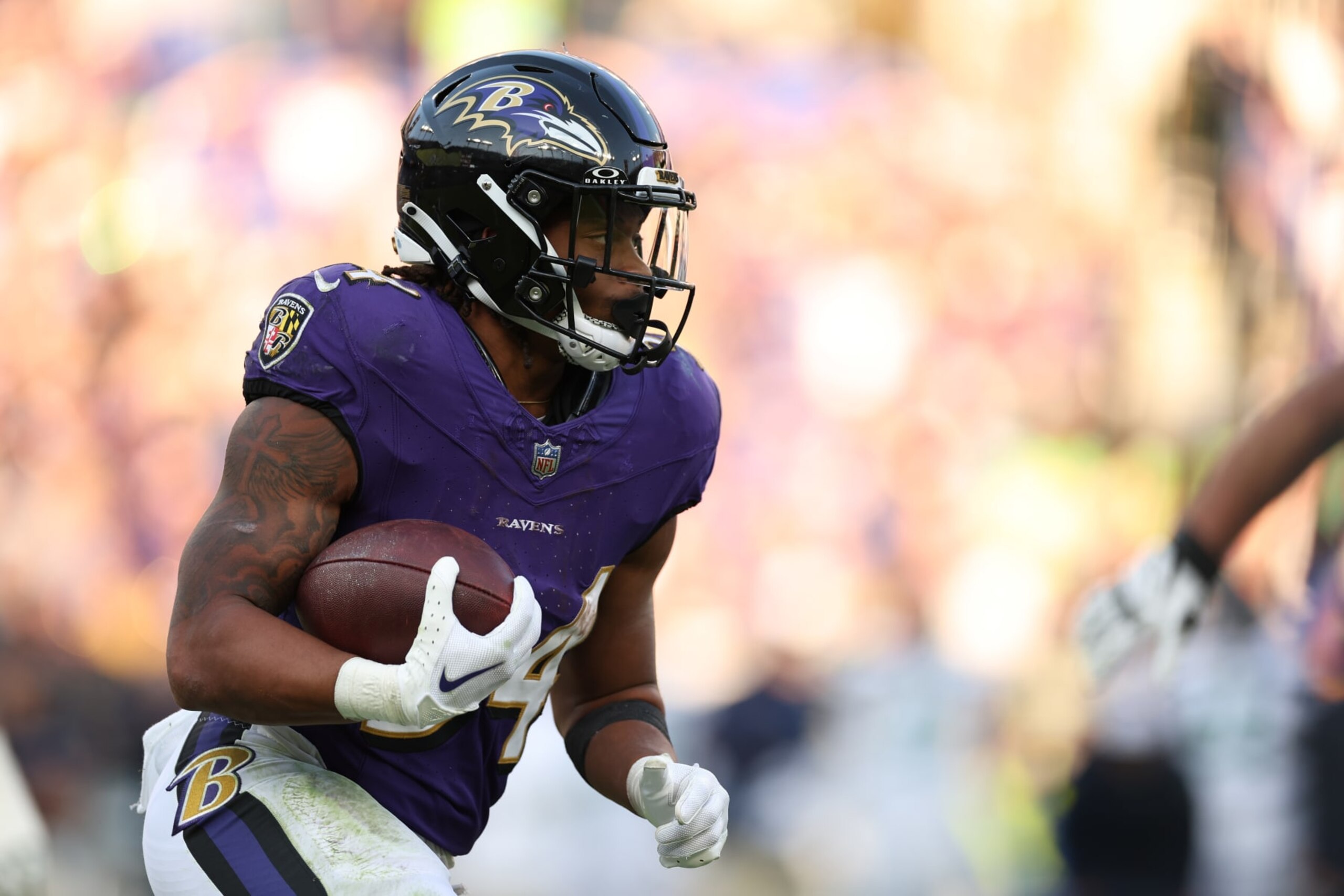 BALTIMORE, MARYLAND - NOVEMBER 05: Keaton Mitchell #34 of the Baltimore Ravens carries the ball against the Seattle Seahawks during the second half at M&T Bank Stadium on November 05, 2023 in Baltimore, Maryland. (Photo by Scott Taetsch/Getty Images)
