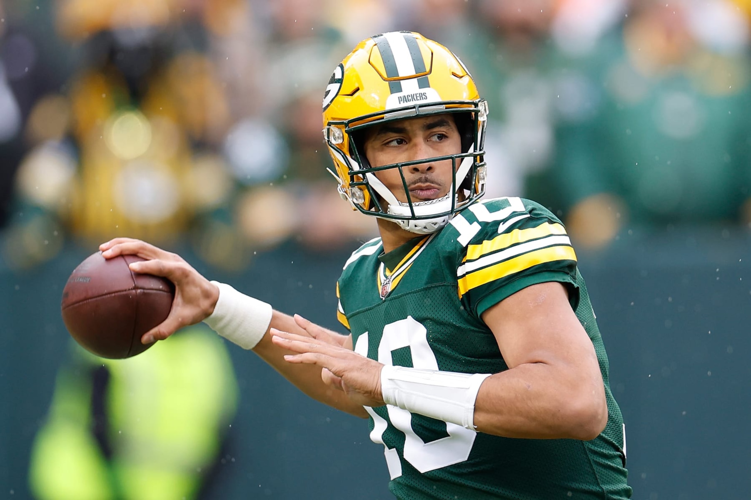 GREEN BAY, WISCONSIN - NOVEMBER 05: Jordan Love #10 of the Green Bay Packers drops back to pass in the first quarter of the game against the Los Angeles Rams at Lambeau Field on November 05, 2023 in Green Bay, Wisconsin. (Photo by John Fisher/Getty Images)