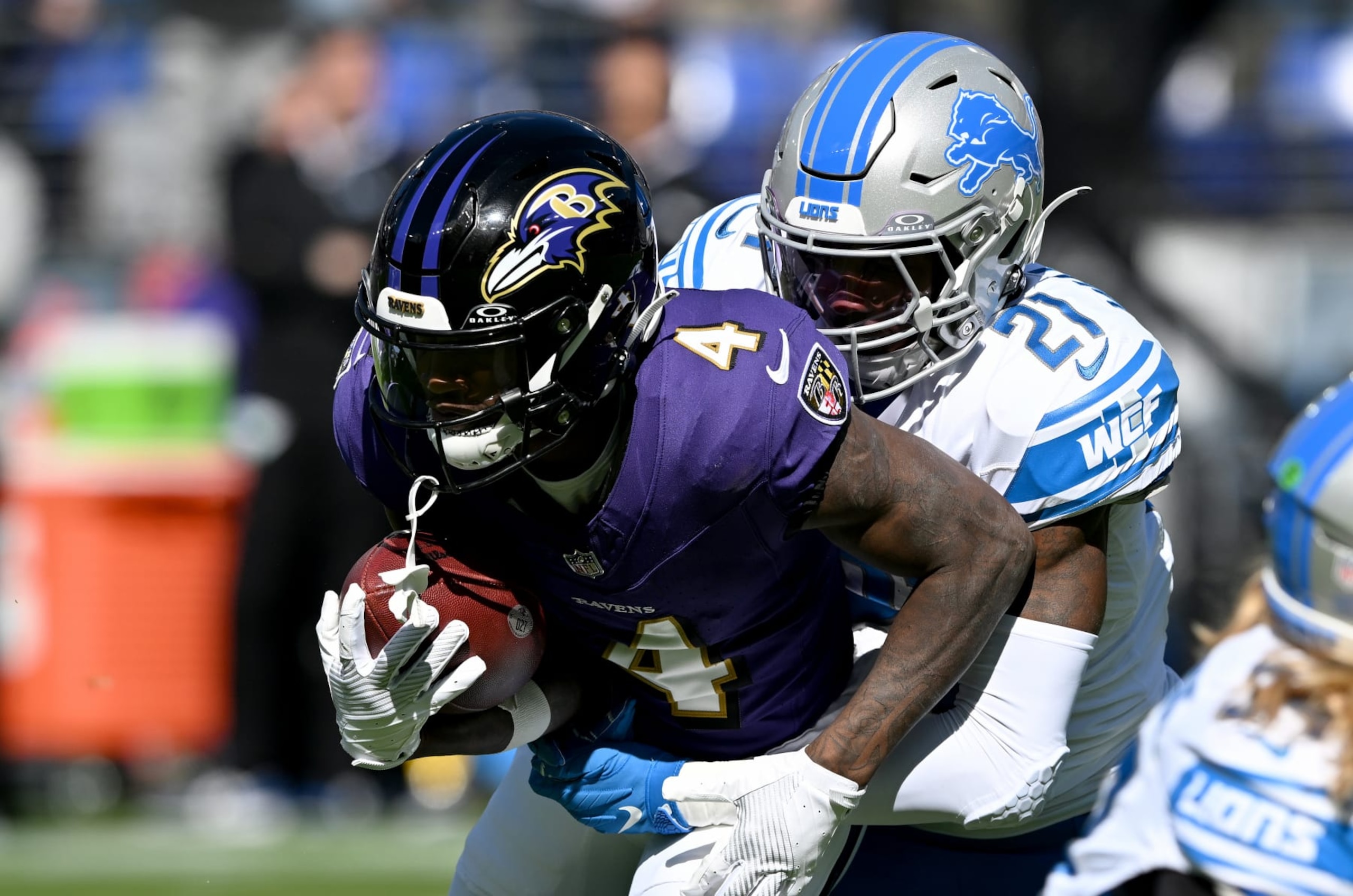 BALTIMORE, MARYLAND - OCTOBER 22: Zay Flowers #4 of the Baltimore Ravens is tackled by Tracy Walker III #21 of the Detroit Lions at M&T Bank Stadium on October 22, 2023 in Baltimore, Maryland. (Photo by G Fiume/Getty Images)