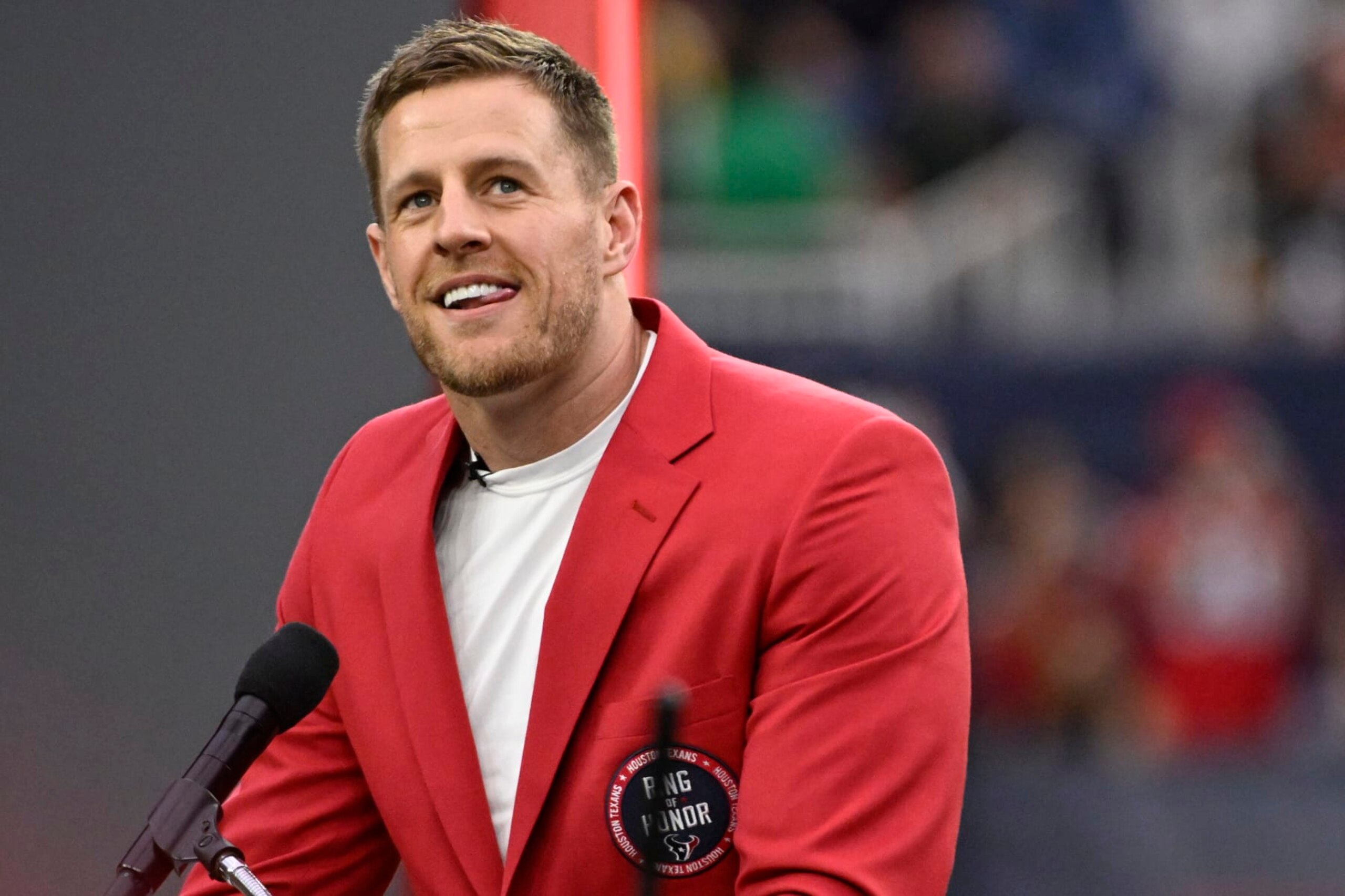 HOUSTON, TEXAS - OCTOBER 01: Former Houston Texans player J.J. Watt speaks during a ceremony inducting him into the Texans Ring of Honor during a game against the Pittsburgh Steelers at NRG Stadium on October 01, 2023 in Houston, Texas. (Photo by Logan Riely/Getty Images)