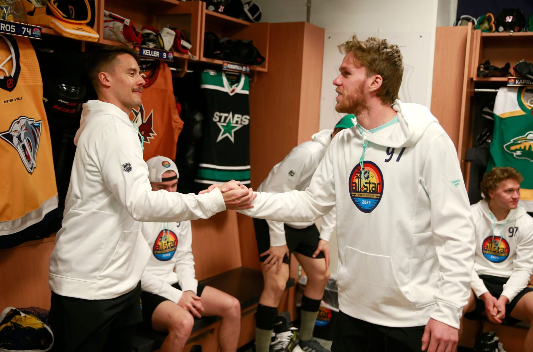 SUNRISE, FLORIDA - FEBRUARY 03: (L-R) Juuse Saros #74 of the Nashville Predators and Connor McDavid #97 of the Edmonton Oilers shake hands in the locker room before the skills competition  at FLA Live Arena on February 03, 2023 in Sunrise, Florida. (Photo by Jeff Vinnick/NHLI via Getty Images)