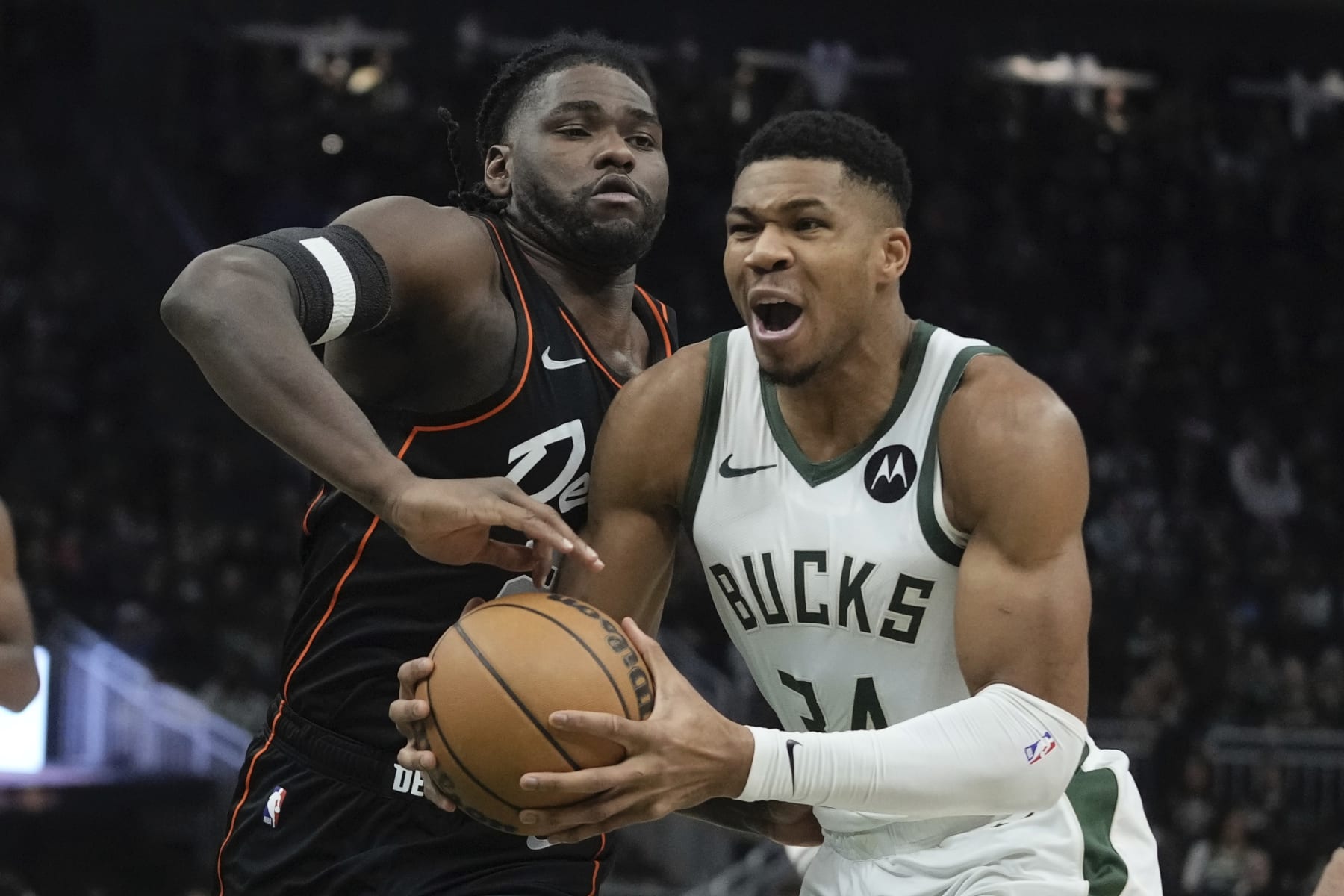 Milwaukee Bucks' Giannis Antetokounmpo drives by Detroit Pistons' Isaiah Stewart during the first half of an NBA basketball game Wednesday, Nov. 8, 2023, in Milwaukee. (AP Photo/Morry Gash)