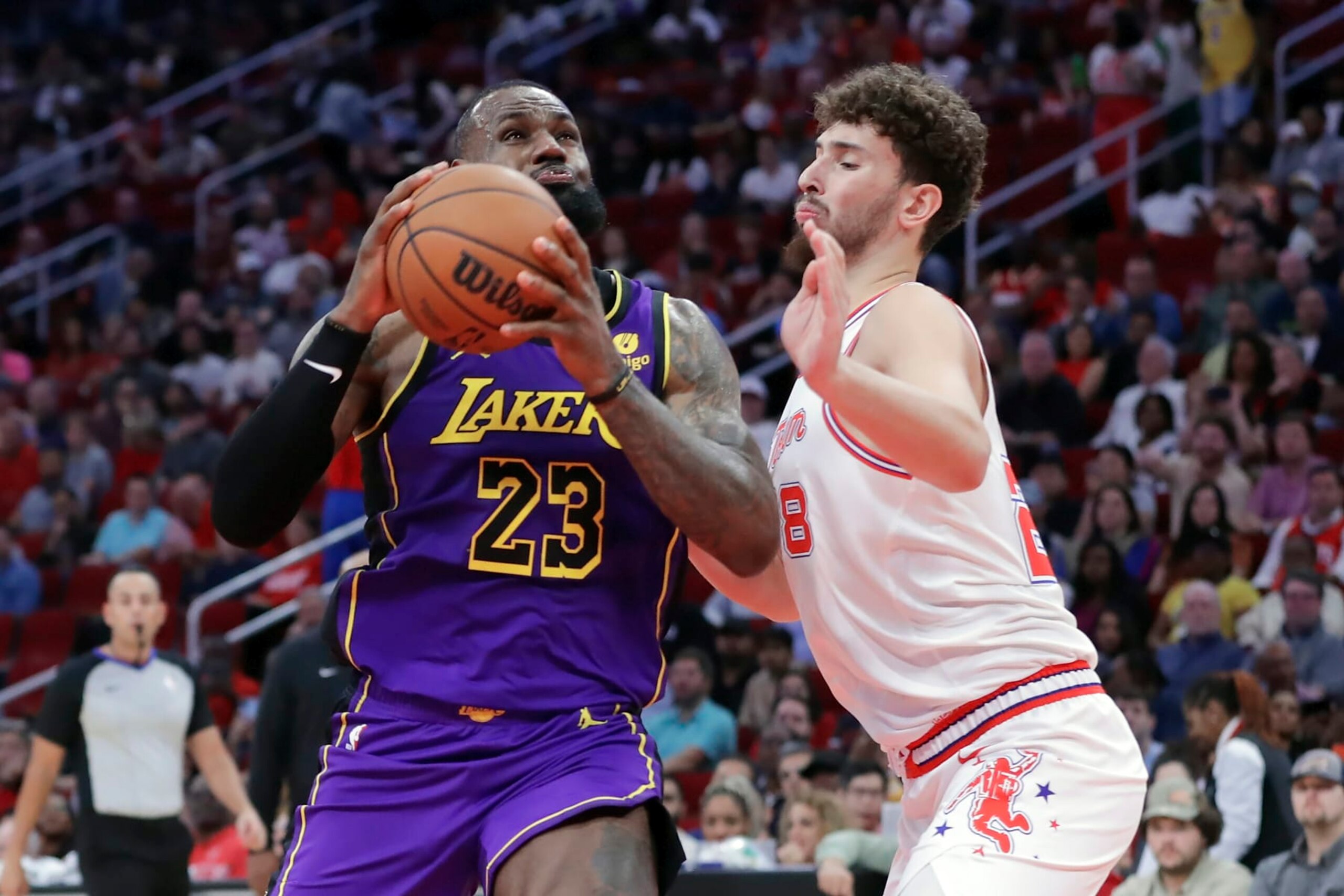 Los Angeles Lakers forward LeBron James (23) drives to the basket under pressure from Houston Rockets center Alperen Sengun during the first half of an NBA basketball game Wednesday, Nov. 8, 2023, in Houston. (AP Photo/Michael Wyke) Los Angeles Lakers forward LeBron James (23) drives to the basket under pressure from Houston Rockets center Alperen Sengun during the first half of an NBA basketball game Wednesday, Nov. 8, 2023, in Houston. (AP Photo/Michael Wyke)
