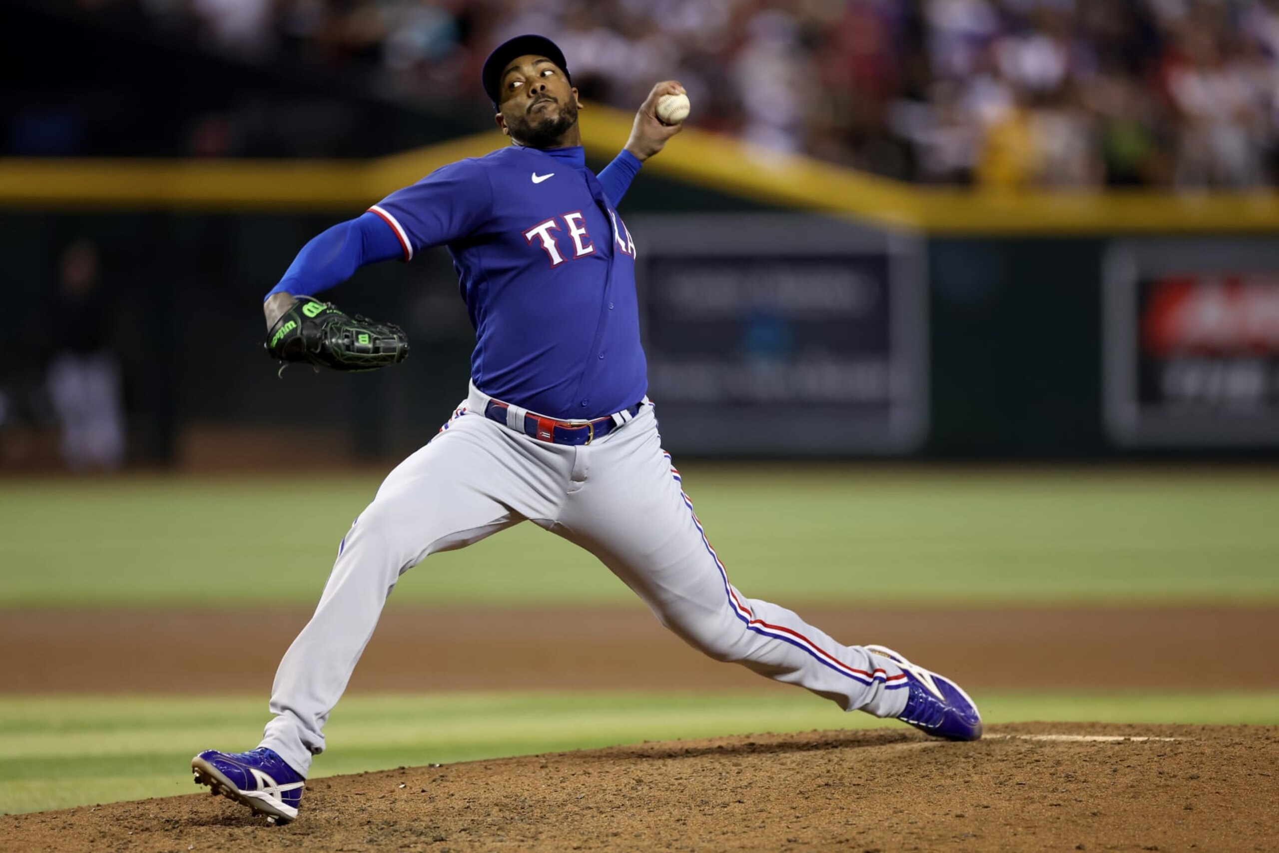 PHOENIX, ARIZONA - NOVEMBER 01: Aroldis Chapman #45 of the Texas Rangers pitches in the seventh inning against the Arizona Diamondbacks during Game Five of the World Series at Chase Field on November 01, 2023 in Phoenix, Arizona. (Photo by Christian Petersen/Getty Images)