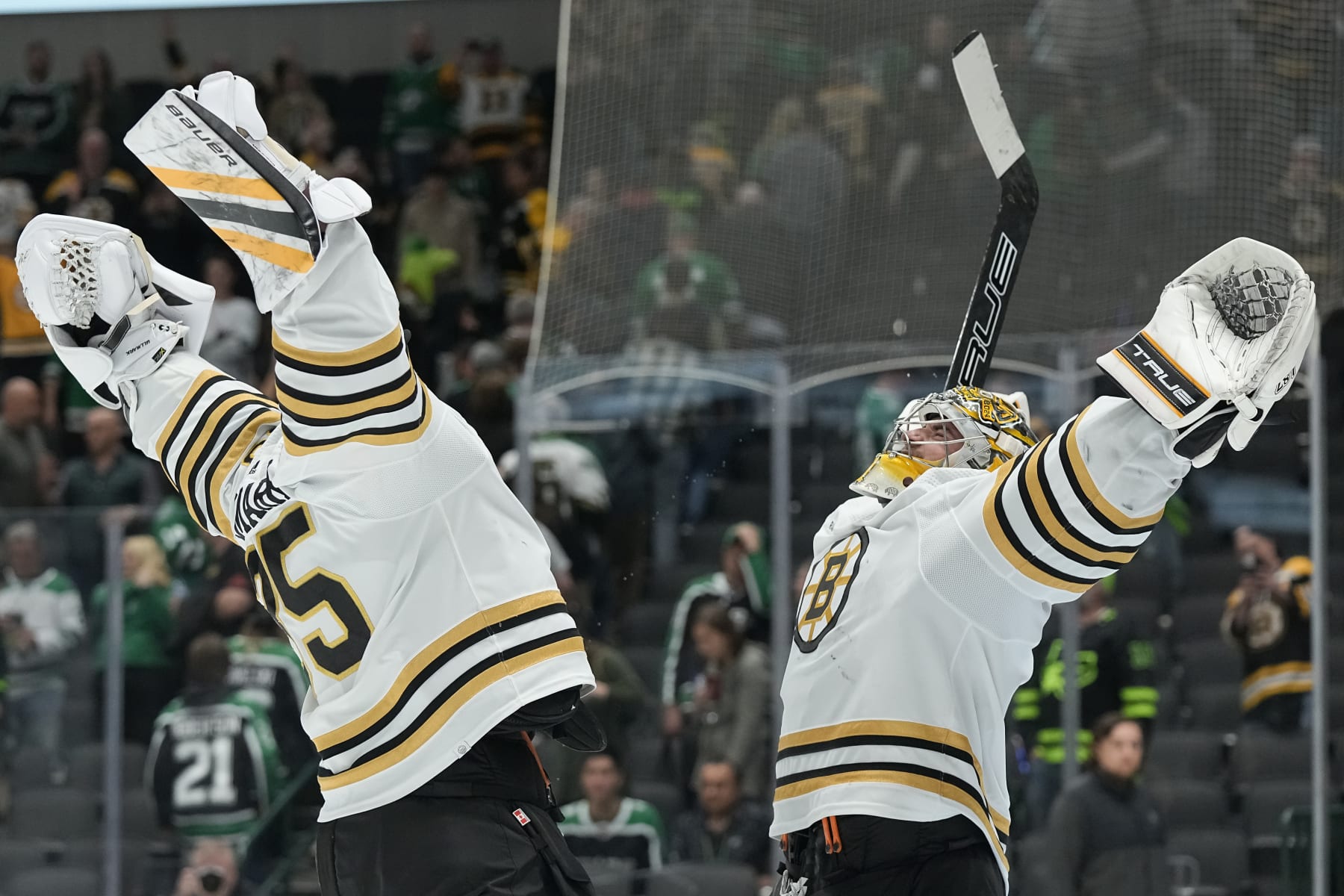 DALLAS, TEXAS - NOVEMBER 06: Linus Ullmark #35 of the Boston Bruins and Jeremy Swayman #1 celebrate after defeating the Dallas Stars at American Airlines Center on November 06, 2023 in Dallas, Texas. (Photo by Sam Hodde/Getty Images)