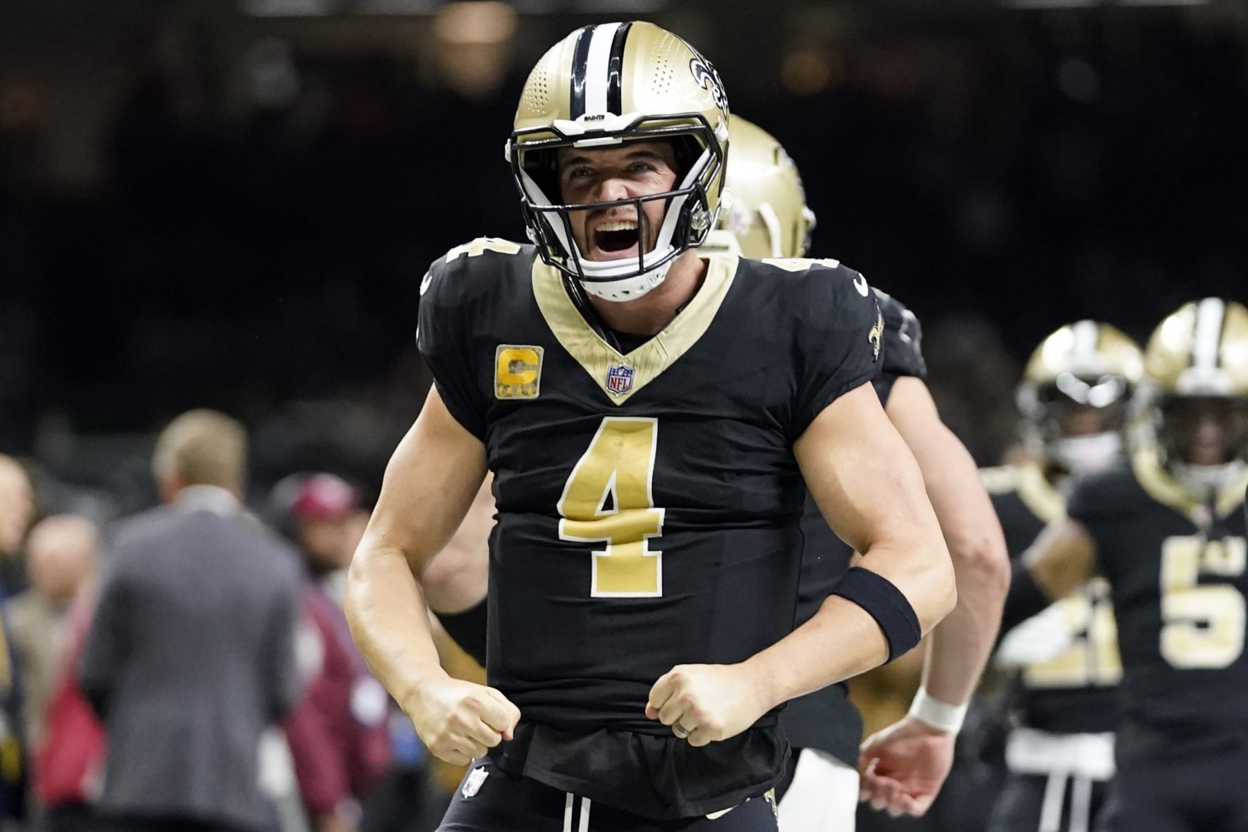 New Orleans Saints quarterback Derek Carr celebrates after throwing a touchdown pass to Taysom Hill during the first half of an NFL football game against the Chicago Bears in New Orleans, Sunday, Nov. 5, 2023. (AP Photo/Gerald Herbert)