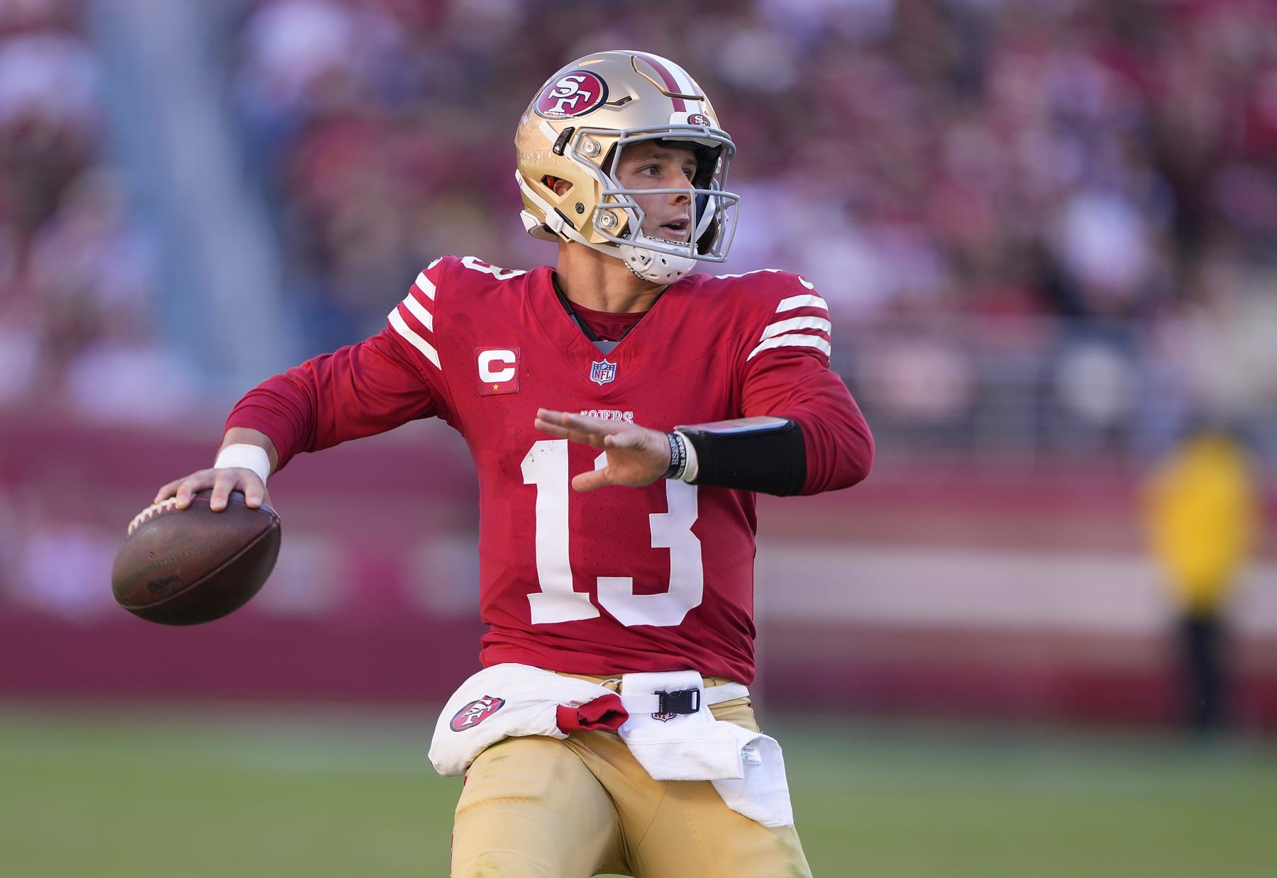 SANTA CLARA, CALIFORNIA - OCTOBER 29: Brock Purdy #13 of the San Francisco 49ers scrambles with the ball looking to pass against the Cincinnati Bengals during the fourth quarter of an NFL football game at Levi's Stadium on October 29, 2023 in Santa Clara, California. (Photo by Thearon W. Henderson/Getty Images)
