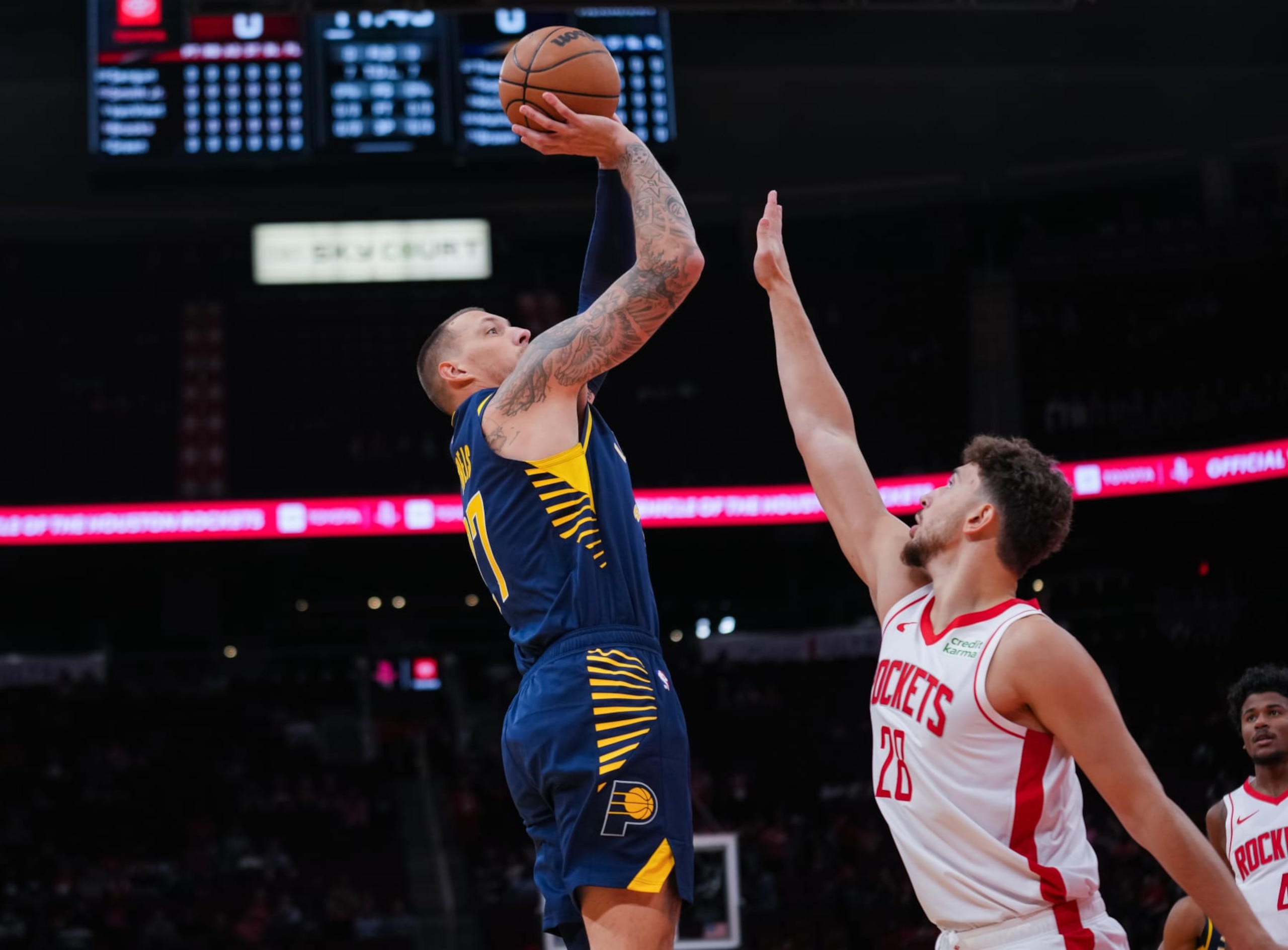 HOUSTON, TEXAS - OCTOBER 10: Daniel Theis #27 of the Indiana Pacers attempts the shot over Alperen Sengun #28 of the Houston Rockets during the preseason game at Toyota Center on October 10, 2023 in Houston, Texas. NOTE TO USER: User expressly acknowledges and agrees that, by downloading and or using this photograph, User is consenting to the terms and conditions of the Getty Images License Agreement. (Photo by Alex Bierens de Haan/Getty Images)