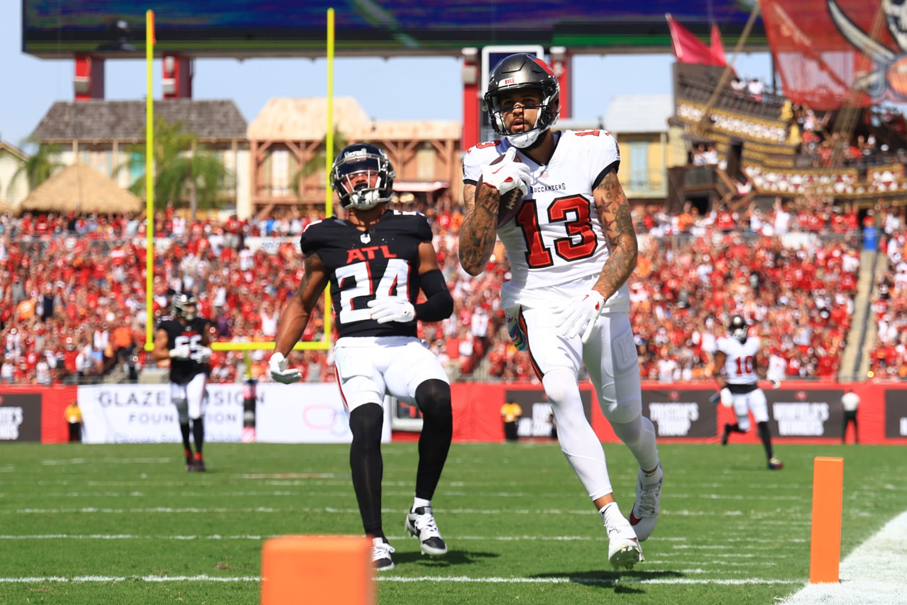TAMPA, FLORIDA - OCTOBER 22: Mike Evans #13 of the Tampa Bay Buccaneers runs in a touchdown during the first quarter of the game against the Atlanta Falcons at Raymond James Stadium on October 22, 2023 in Tampa, Florida. (Photo by Mike Ehrmann/Getty Images) TAMPA, FLORIDA - OCTOBER 22: Mike Evans #13 of the Tampa Bay Buccaneers runs in a touchdown during the first quarter of the game against the Atlanta Falcons at Raymond James Stadium on October 22, 2023 in Tampa, Florida. (Photo by Mike Ehrmann/Getty Images)
