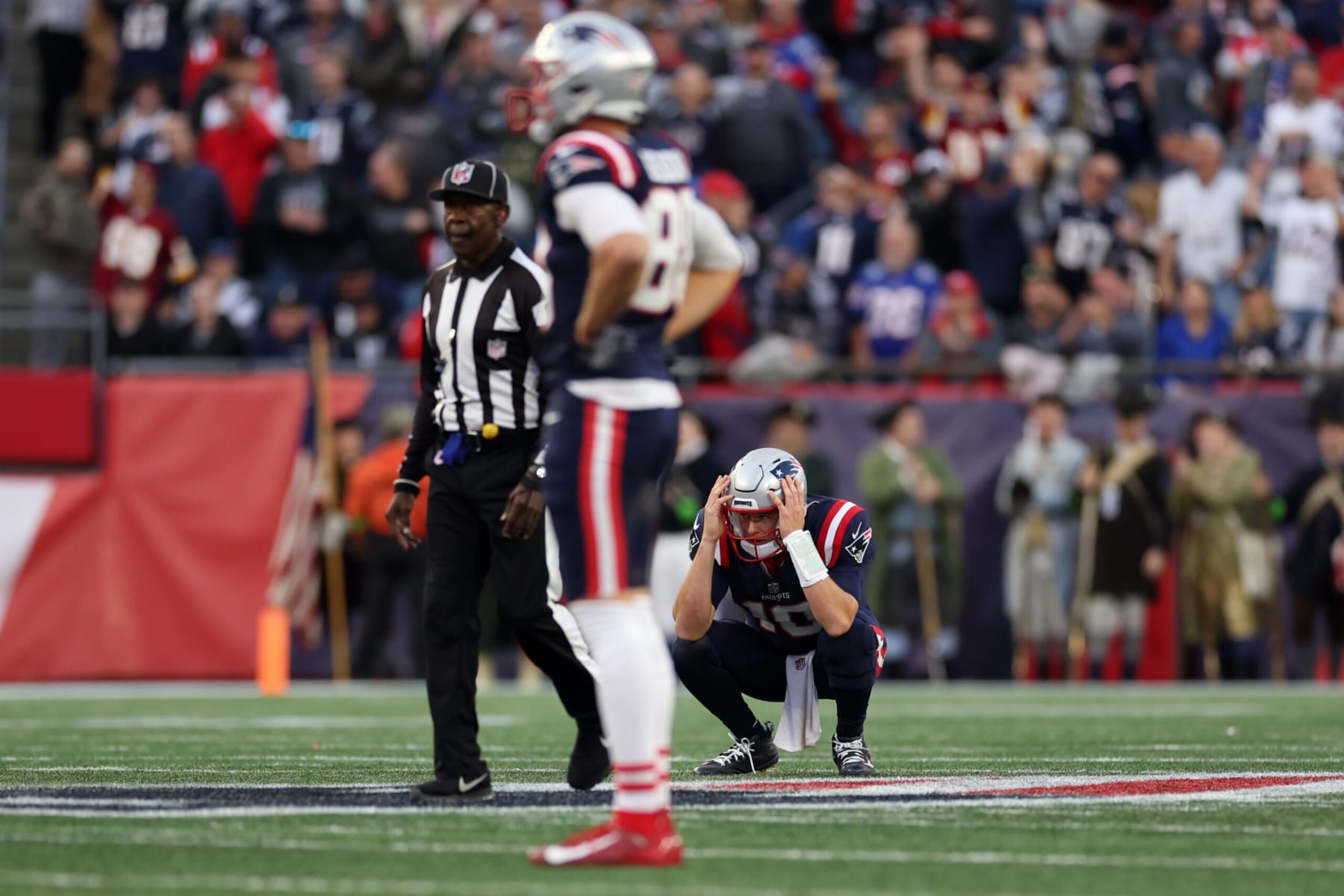 FOXBOROUGH, MASSACHUSETTS - NOVEMBER 05: Mac Jones #10 of the New England Patriots reacts after an interception during the second half in the game against the Washington Commanders at Gillette Stadium on November 05, 2023 in Foxborough, Massachusetts. (Photo by Maddie Meyer/Getty Images)