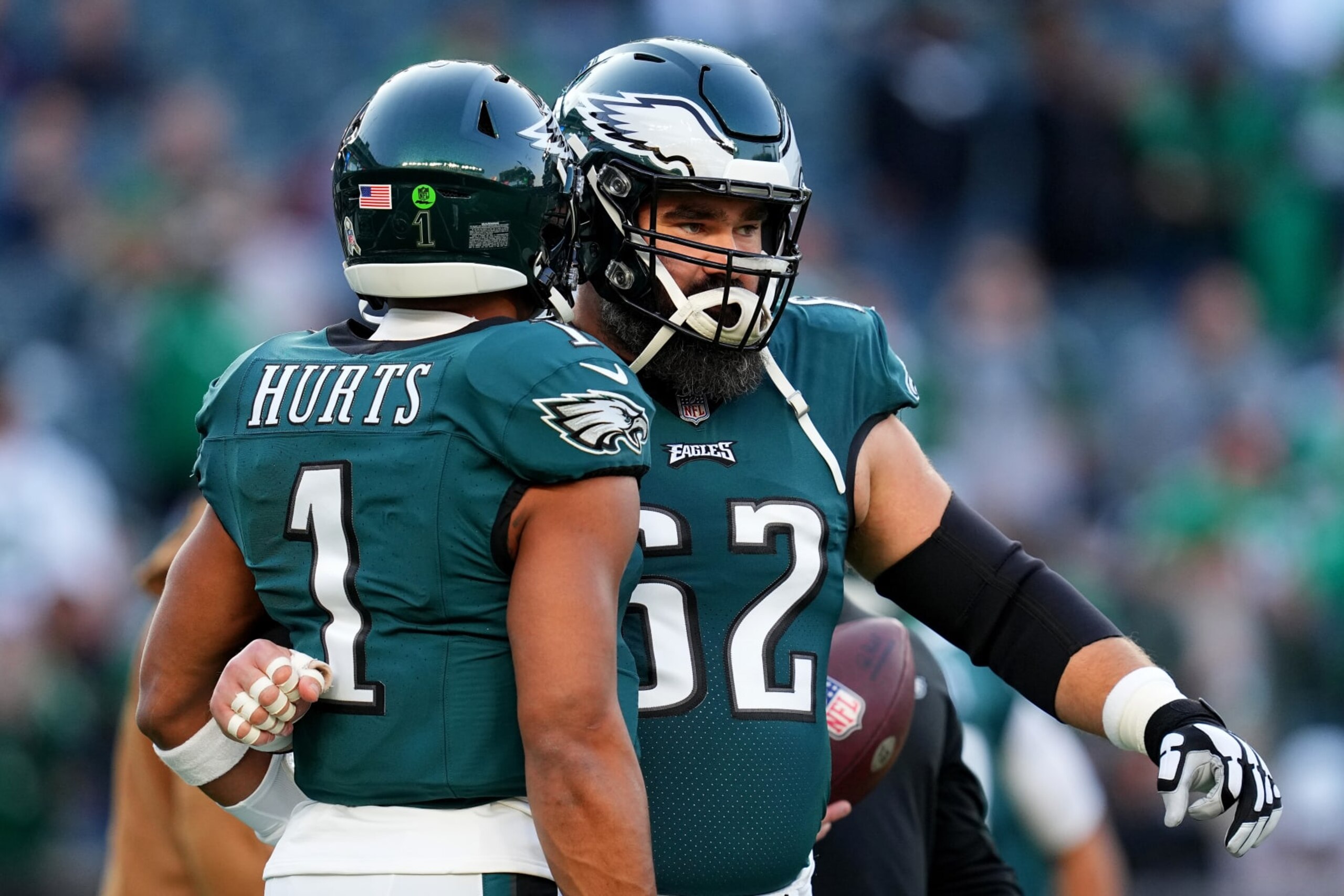 PHILADELPHIA, PENNSYLVANIA - NOVEMBER 05: Jalen Hurts #1 and Jason Kelce #62 of the Philadelphia Eagles embrace prior to a game against the Dallas Cowboys at Lincoln Financial Field on November 05, 2023 in Philadelphia, Pennsylvania. (Photo by Mitchell Leff/Getty Images)