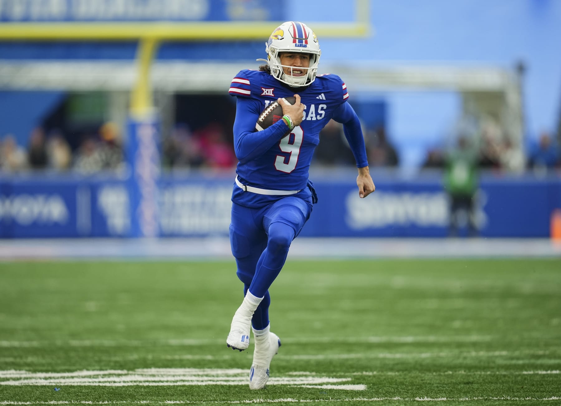LAWRENCE, KANSAS - OCTOBER 28: Quarterback Jason Bean #9 of the Kansas Jayhawks runs for a touchdown during the second half against the Oklahoma Sooners at David Booth Kansas Memorial Stadium on October 28, 2023 in Lawrence, Kansas. (Photo by Jay Biggerstaff/Getty Images)