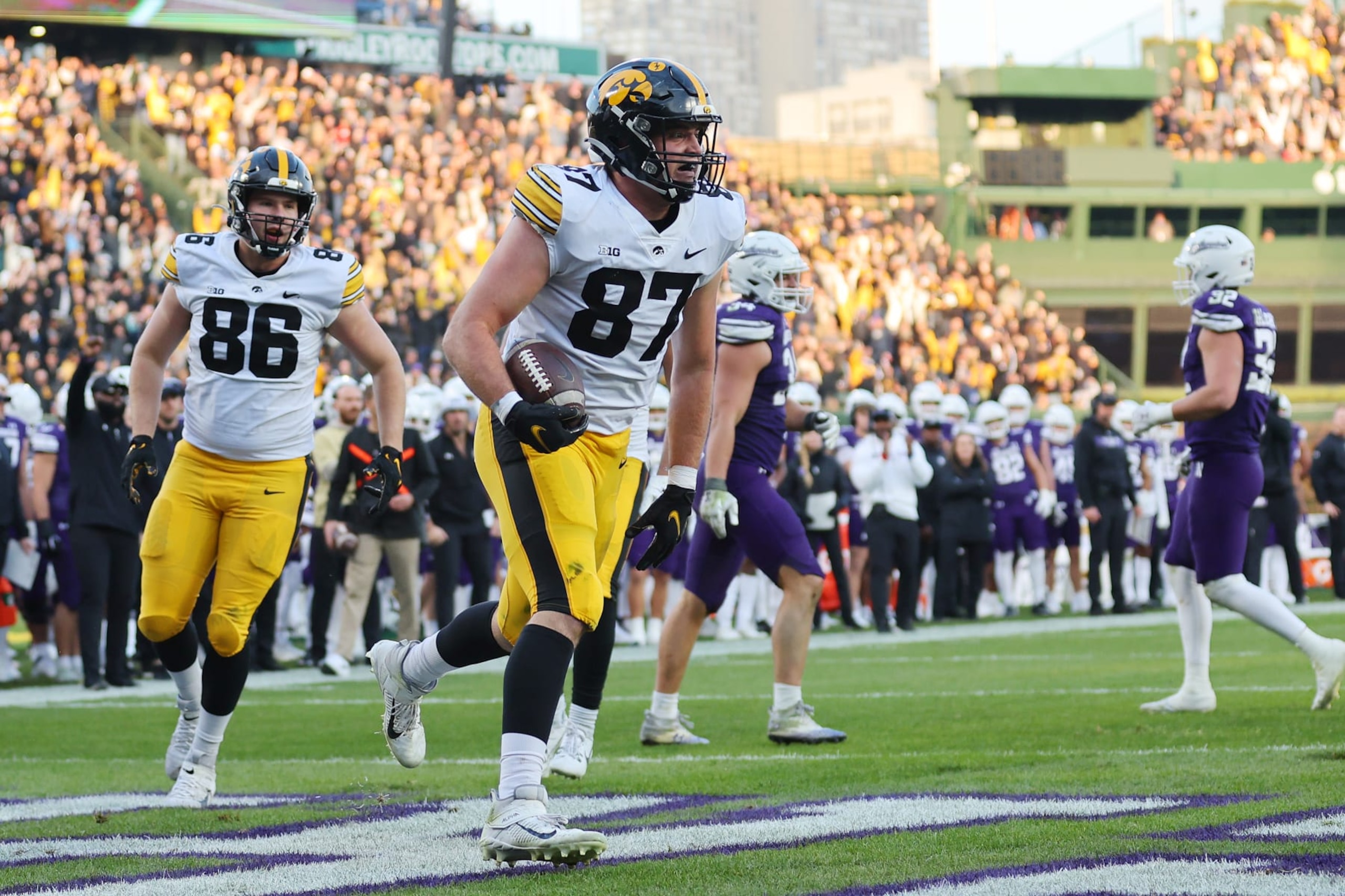 CHICAGO, ILLINOIS - NOVEMBER 04: Addison Ostrenga #87 of the Iowa Hawkeyes celebrates a touchdown reception against the Northwestern Wildcats during the second half at Wrigley Field on November 04, 2023 in Chicago, Illinois. (Photo by Michael Reaves/Getty Images) CHICAGO, ILLINOIS - NOVEMBER 04: Addison Ostrenga #87 of the Iowa Hawkeyes celebrates a touchdown reception against the Northwestern Wildcats during the second half at Wrigley Field on November 04, 2023 in Chicago, Illinois. (Photo by Michael Reaves/Getty Images)
