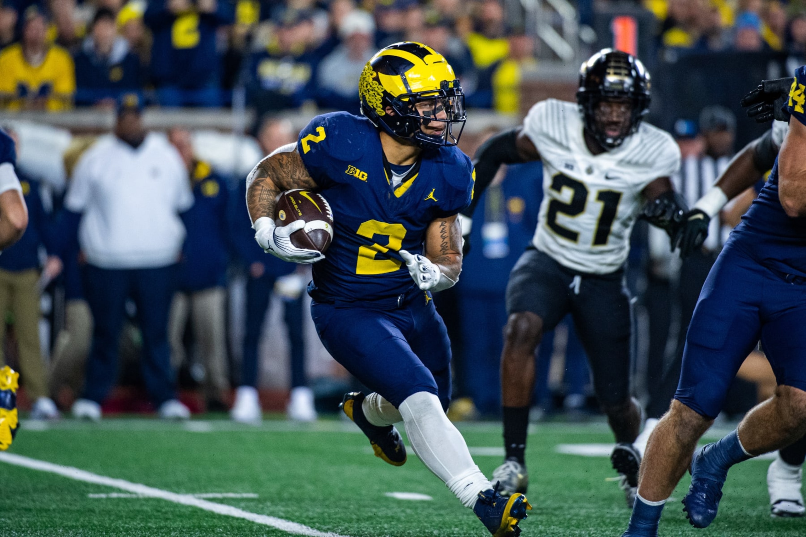 ANN ARBOR, MICHIGAN - NOVEMBER 04: Blake Corum #2 of the Michigan Wolverines runs with the ball during the first half of a college football game against the Purdue Boilermakers at Michigan Stadium on November 04, 2023 in Ann Arbor, Michigan. (Photo by Aaron J. Thornton/Getty Images)