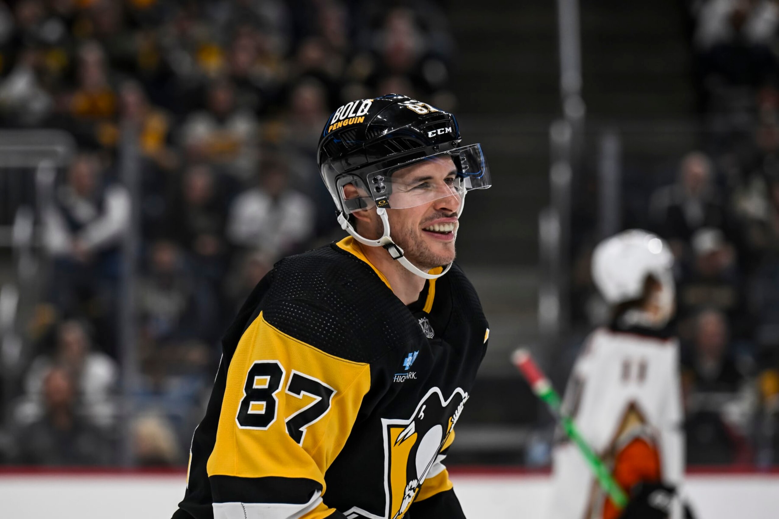PITTSBURGH, PA - OCTOBER 30: Pittsburgh Penguins center Sidney Crosby (87) smiles during the second period in the NHL game between the Pittsburgh Penguins and the Anaheim Ducks on October 30, 2023, at PPG Paints Arena in Pittsburgh, PA. (Photo by Jeanine Leech/Icon Sportswire via Getty Images) PITTSBURGH, PA - OCTOBER 30: Pittsburgh Penguins center Sidney Crosby (87) smiles during the second period in the NHL game between the Pittsburgh Penguins and the Anaheim Ducks on October 30, 2023, at PPG Paints Arena in Pittsburgh, PA. (Photo by Jeanine Leech/Icon Sportswire via Getty Images)