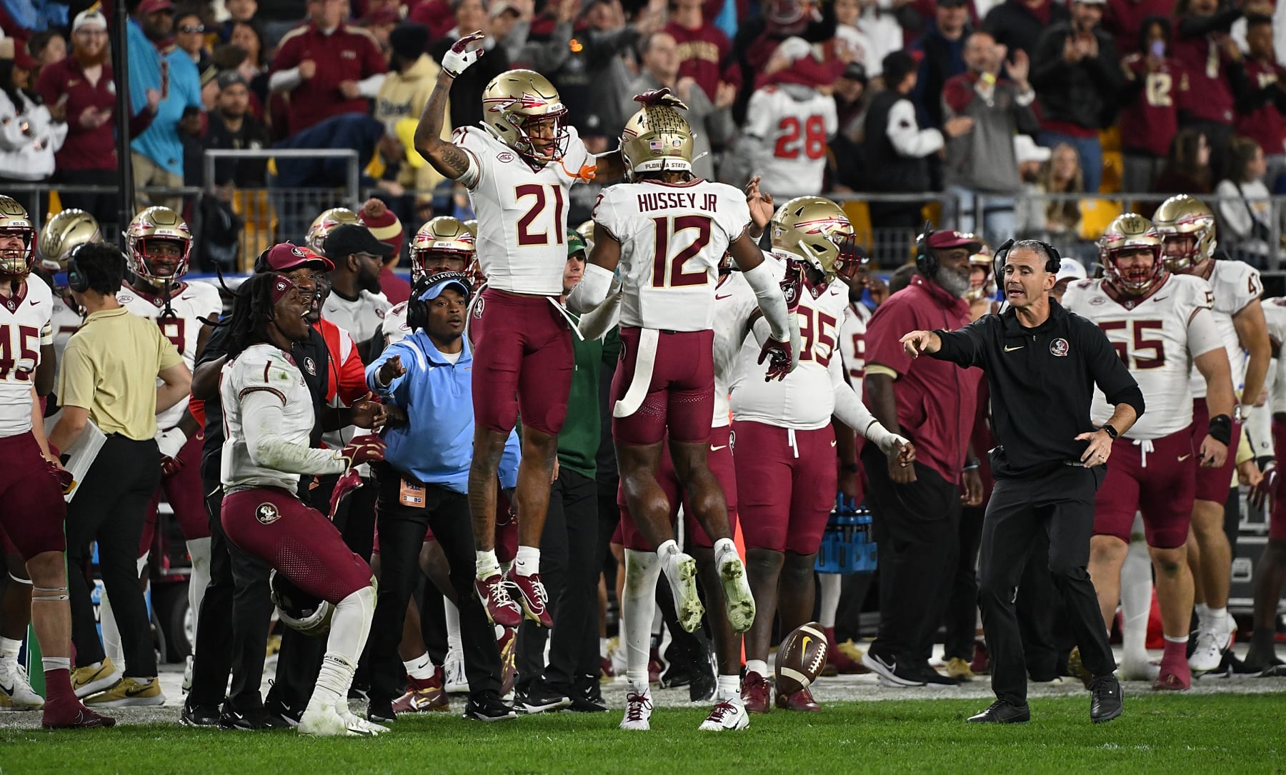 PITTSBURGH, PENNSYLVANIA - NOVEMBER 4: Conrad Hussey #12 of the Florida State Seminoles celebrates with Greedy Vance Jr. #21 after forcing a fumble in the fourth quarter during the game against the Pittsburgh Panthers at Acrisure Stadium on November 4, 2023 in Pittsburgh, Pennsylvania. (Photo by Justin Berl/Getty Images)