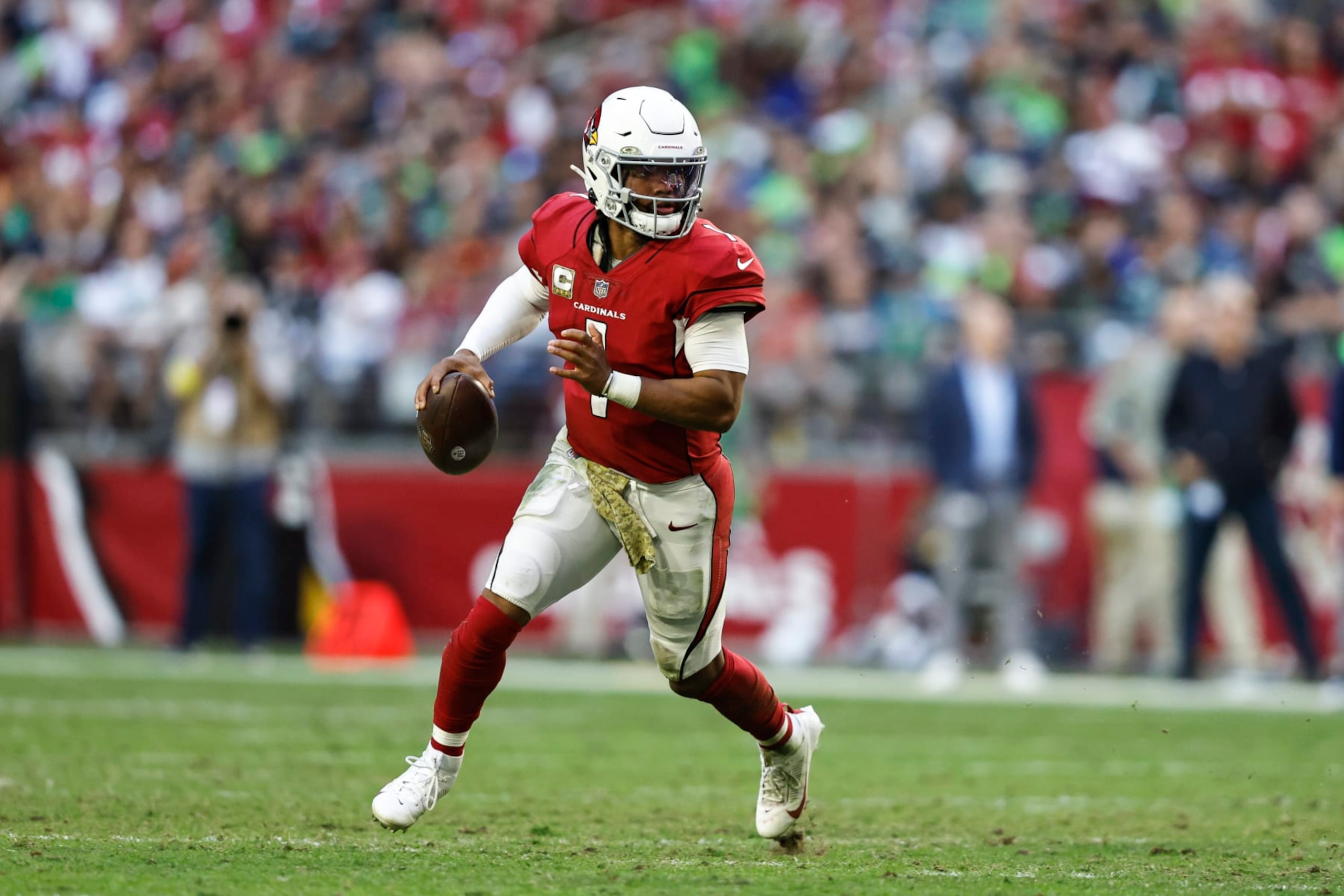 GLENDALE, ARIZONA - NOVEMBER 06: Kyler Murray #1 of the Arizona Cardinals scrambles and looks to pass during an NFL Football game between the Arizona Cardinals and the Seattle Seahawks at State Farm Stadium on November 06, 2022 in Glendale, Arizona. (Photo by Michael Owens/Getty Images)