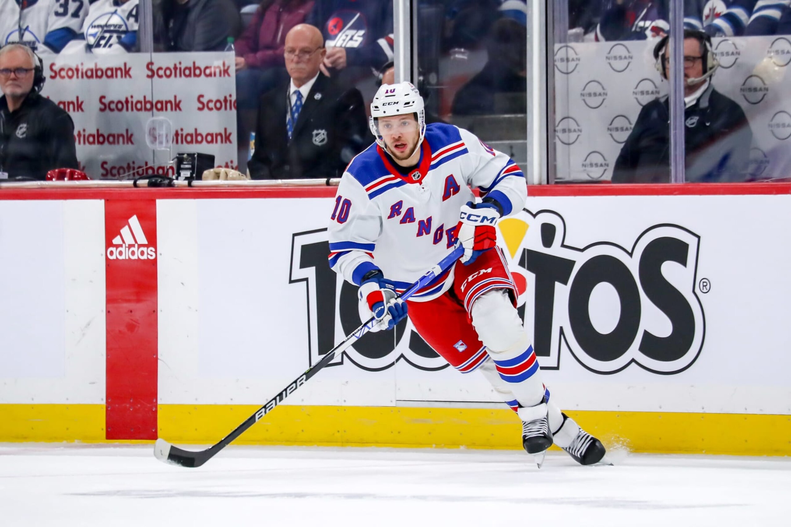 WINNIPEG, CANADA - OCTOBER 30: Artemi Panarin #10 of the New York Rangers follows the play down the ice during first period action against the Winnipeg Jets at the Canada Life Centre on October 30, 2023 in Winnipeg, Manitoba, Canada. The Rangers defeated the Jets 3-2 in overtime. (Photo by Darcy Finley/NHLI via Getty Images)