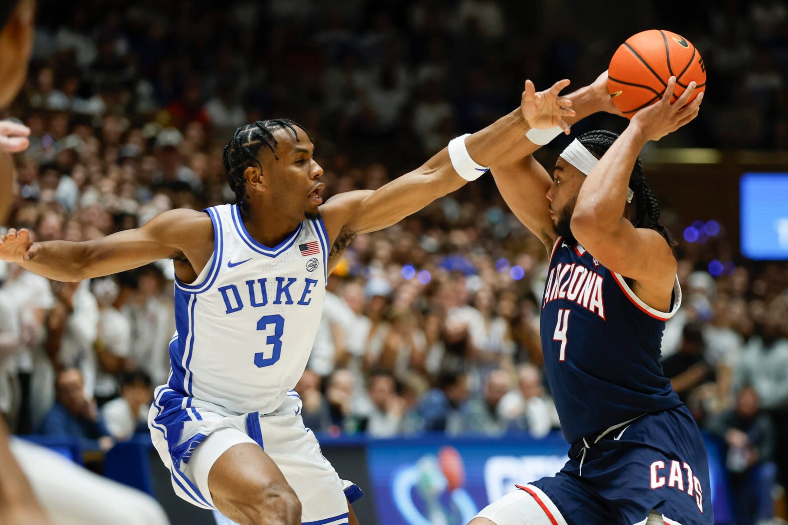 Arizona guard Kylan Boswell (4) looks to pass against Duke guard Jeremy Roach (3) during the first half of an NCAA college basketball game in Durham, N.C., Friday, Nov. 10, 2023. (AP Photo/Nell Redmond) Arizona guard Kylan Boswell (4) looks to pass against Duke guard Jeremy Roach (3) during the first half of an NCAA college basketball game in Durham, N.C., Friday, Nov. 10, 2023. (AP Photo/Nell Redmond)