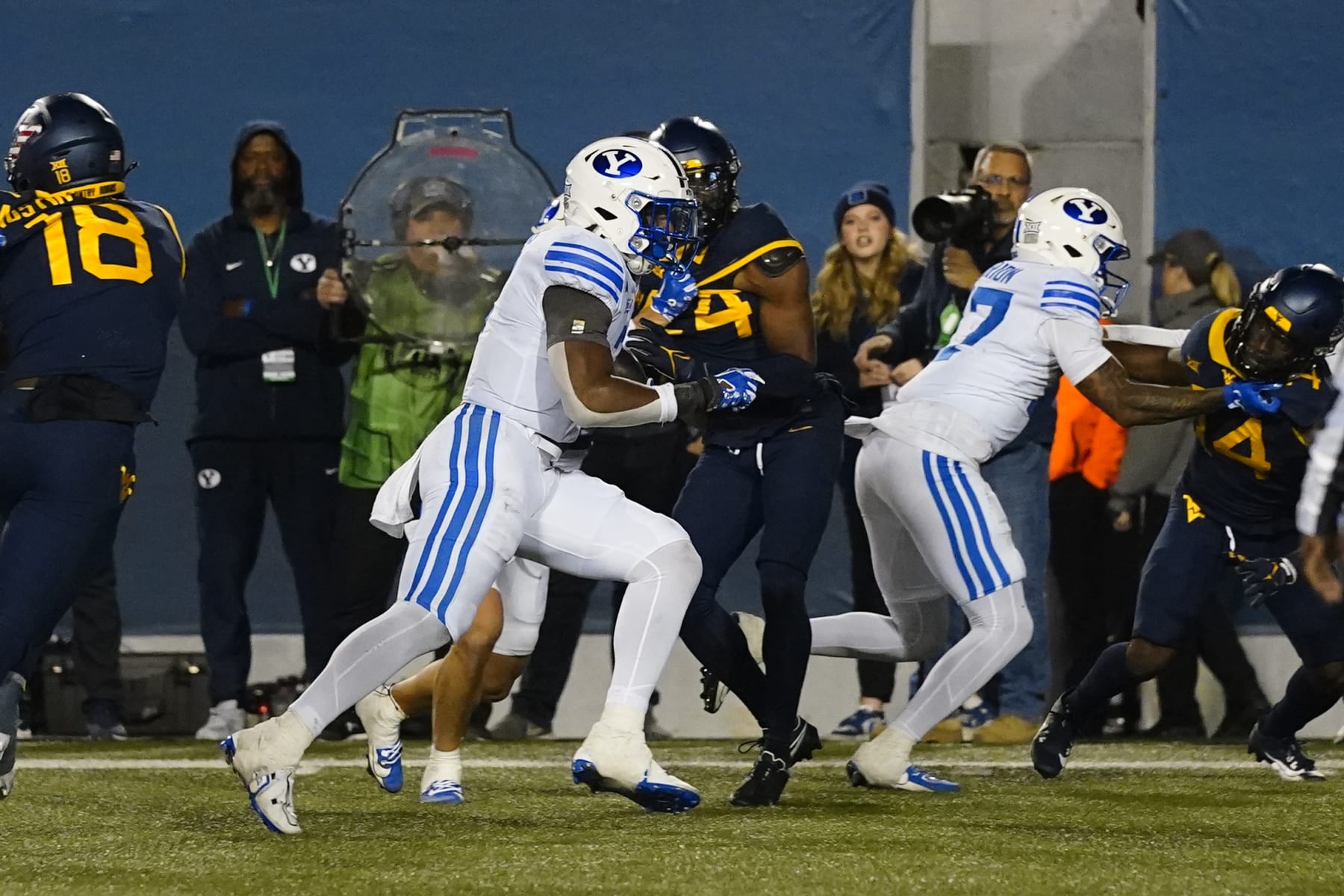 MORGANTOWN, WV - NOVEMBER 04: Brigham Young Cougars Running Back Aidan Robbins (3) runs with the ball for a touchdown during the second half of the College Football Game between the Brigham Young Cougars and the West Virginia Mountaineers on November 4, 2023, at Mountaineer Field at Milan Puskar Stadium in Morgantown, WV. (Photo by Gregory Fisher/Icon Sportswire via Getty Images)