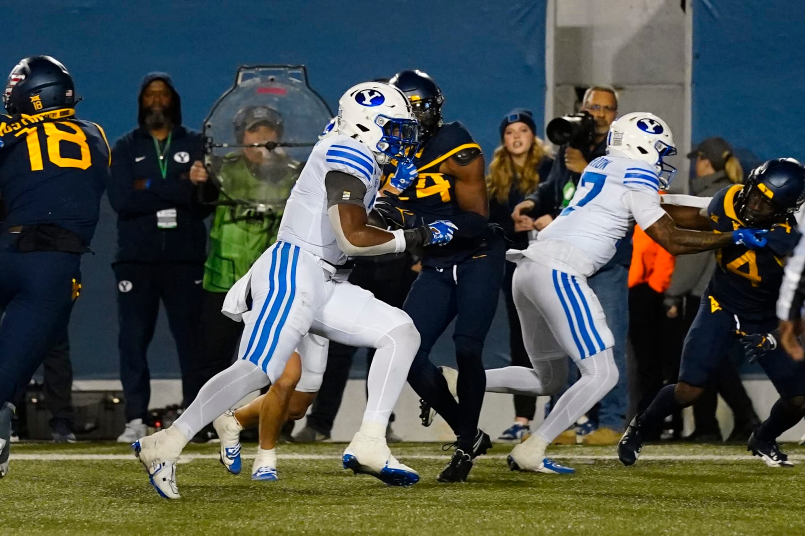 MORGANTOWN, WV - NOVEMBER 04: Brigham Young Cougars Running Back Aidan Robbins (3) runs with the ball for a touchdown during the second half of the College Football Game between the Brigham Young Cougars and the West Virginia Mountaineers on November 4, 2023, at Mountaineer Field at Milan Puskar Stadium in Morgantown, WV. (Photo by Gregory Fisher/Icon Sportswire via Getty Images)