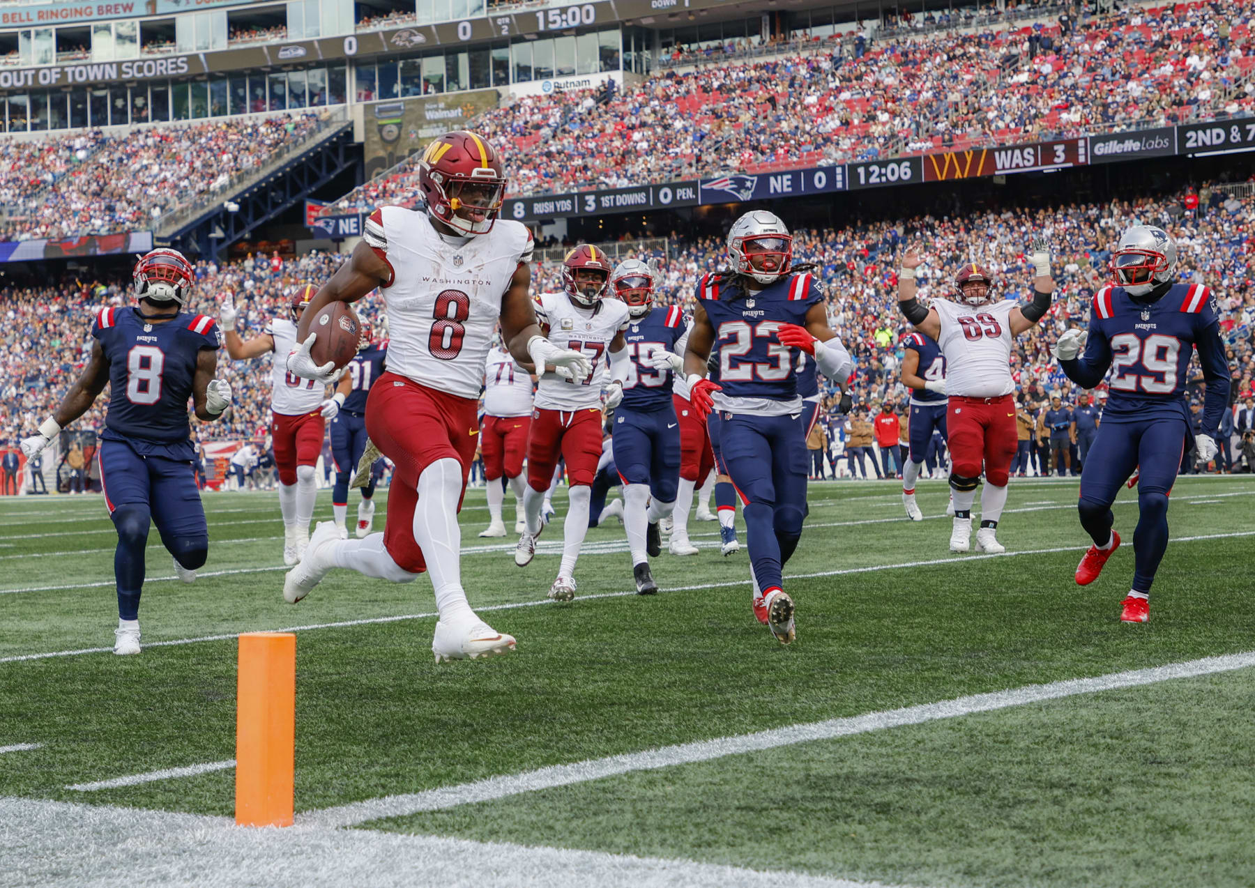 Foxborough, MA - November 5: Washington Commanders RB Brian Robinson Jr. scores in the second quarter. The Commanders beat the New England Patriots, 20-17. (Photo by Matthew J. Lee/The Boston Globe via Getty Images)