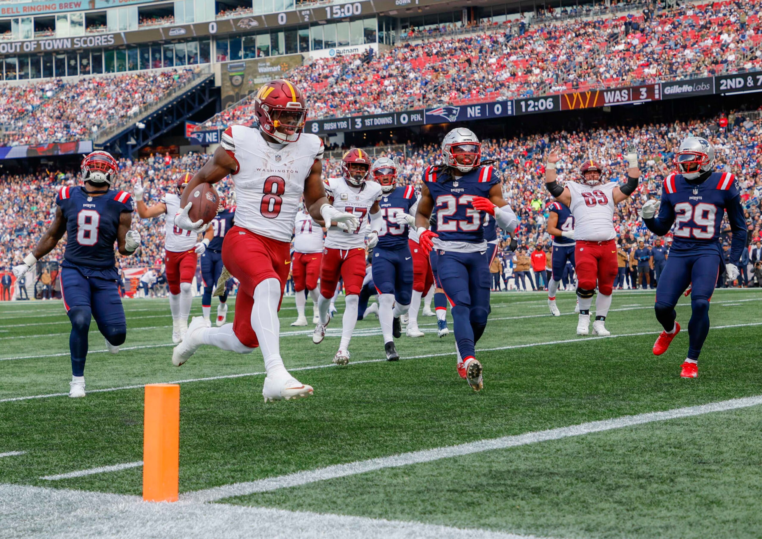 Foxborough, MA - November 5: Washington Commanders RB Brian Robinson Jr. scores in the second quarter. The Commanders beat the New England Patriots, 20-17. (Photo by Matthew J. Lee/The Boston Globe via Getty Images)