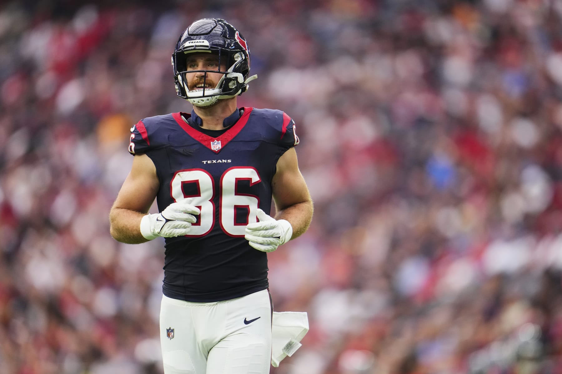 HOUSTON, TX - NOVEMBER 05: Dalton Schultz #86 of the Houston Texans jogs onto the field against the Tampa Bay Buccaneers during the first half at NRG Stadium on November 5, 2023 in Houston, Texas. (Photo by Cooper Neill/Getty Images)