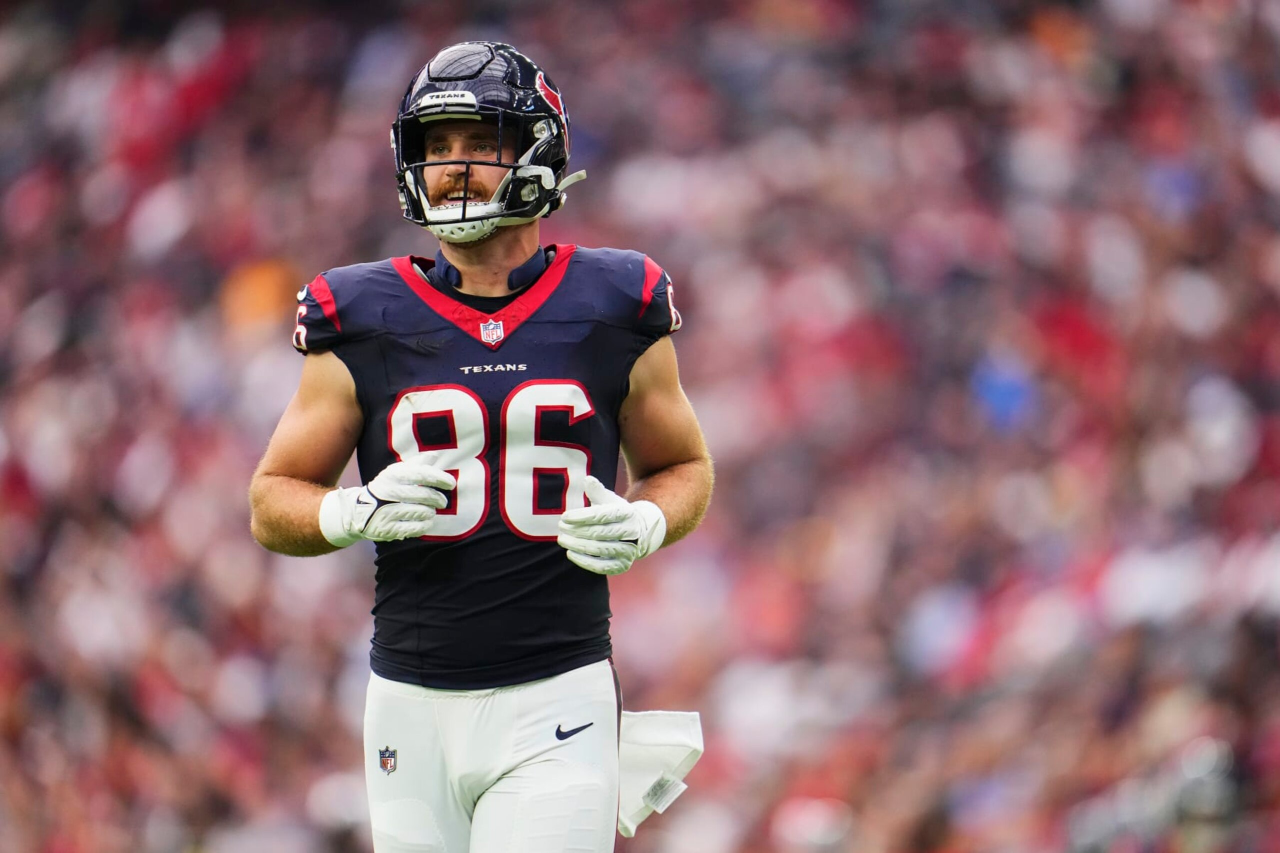 HOUSTON, TX - NOVEMBER 05: Dalton Schultz #86 of the Houston Texans jogs onto the field against the Tampa Bay Buccaneers during the first half at NRG Stadium on November 5, 2023 in Houston, Texas. (Photo by Cooper Neill/Getty Images)