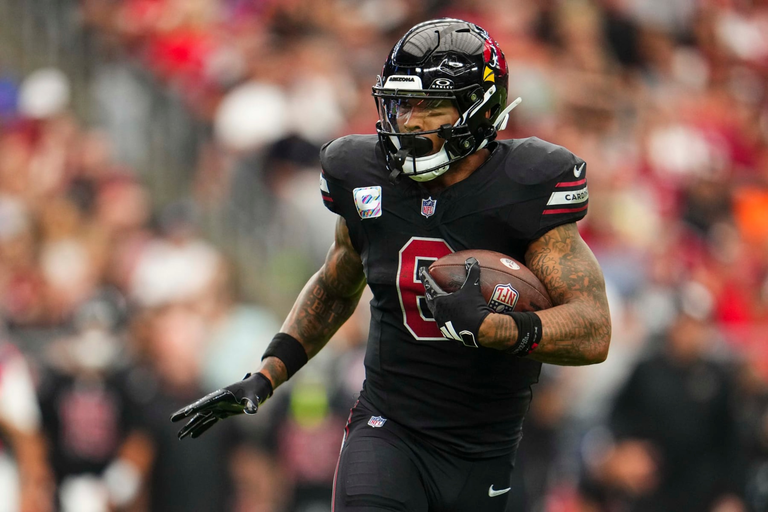 GLENDALE, AZ - OCTOBER 08: James Conner #6 of the Arizona Cardinals runs the ball during an NFL game against the Cincinnati Bengals at State Farm Stadium on October 8, 2023 in Glendale, Arizona. (Photo by Cooper Neill/Getty Images)