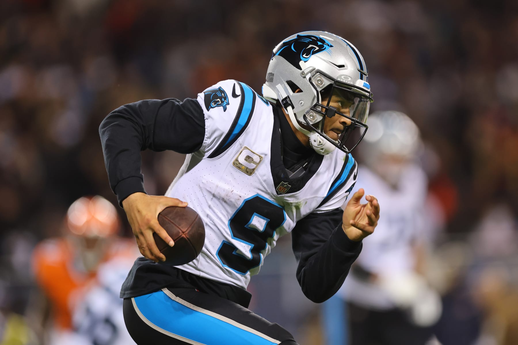 CHICAGO, ILLINOIS - NOVEMBER 09: Bryce Young #9 of the Carolina Panthers rushes for a first down during the fourth quarter against the Chicago Bears at Soldier Field on November 09, 2023 in Chicago, Illinois. (Photo by Michael Reaves/Getty Images)