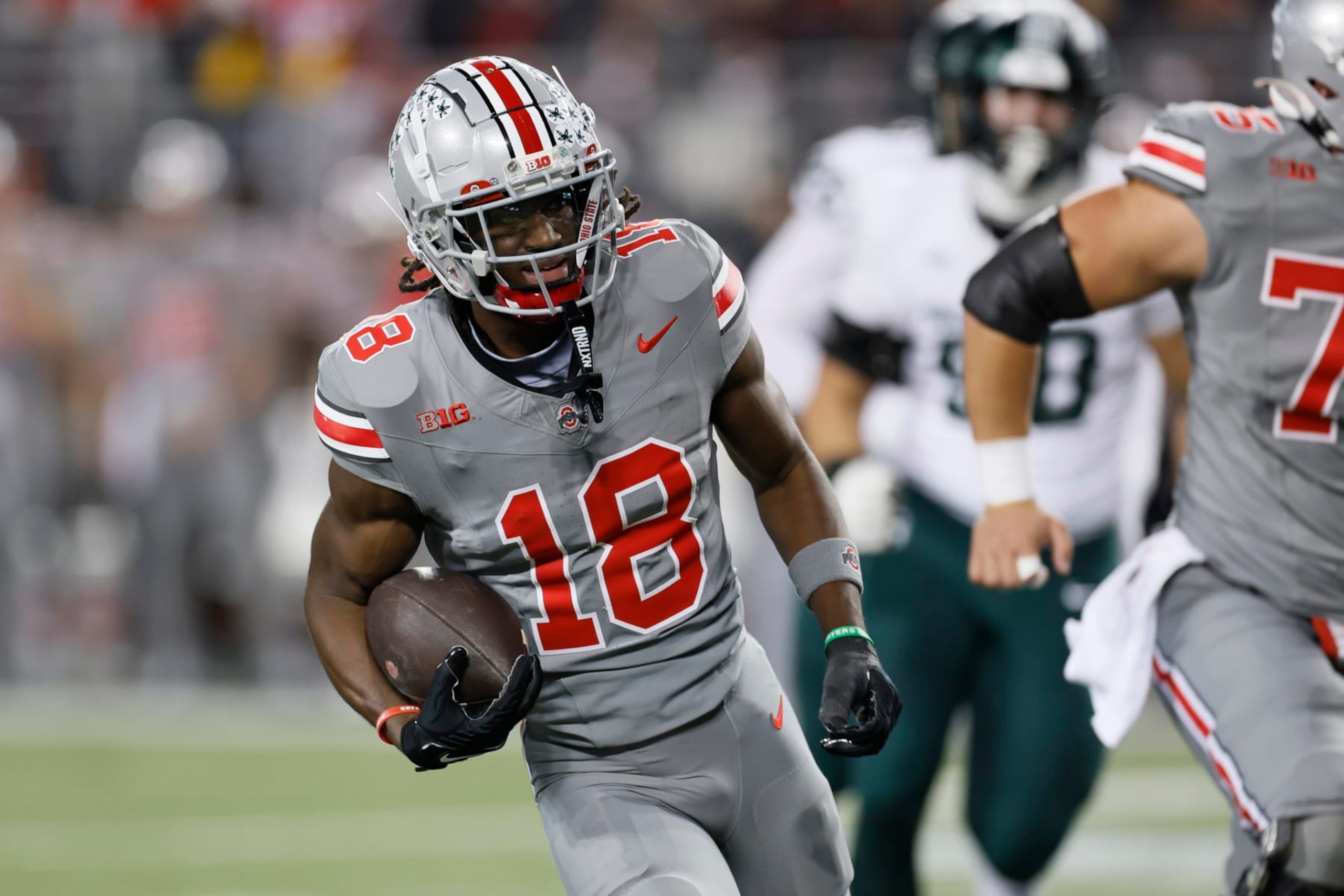 Ohio State receiver Marvin Harrison runs for a touchdown against Michigan State during the first half of an NCAA college football game Saturday, Nov. 11, 2023, in Columbus, Ohio. (AP Photo/Jay LaPrete)