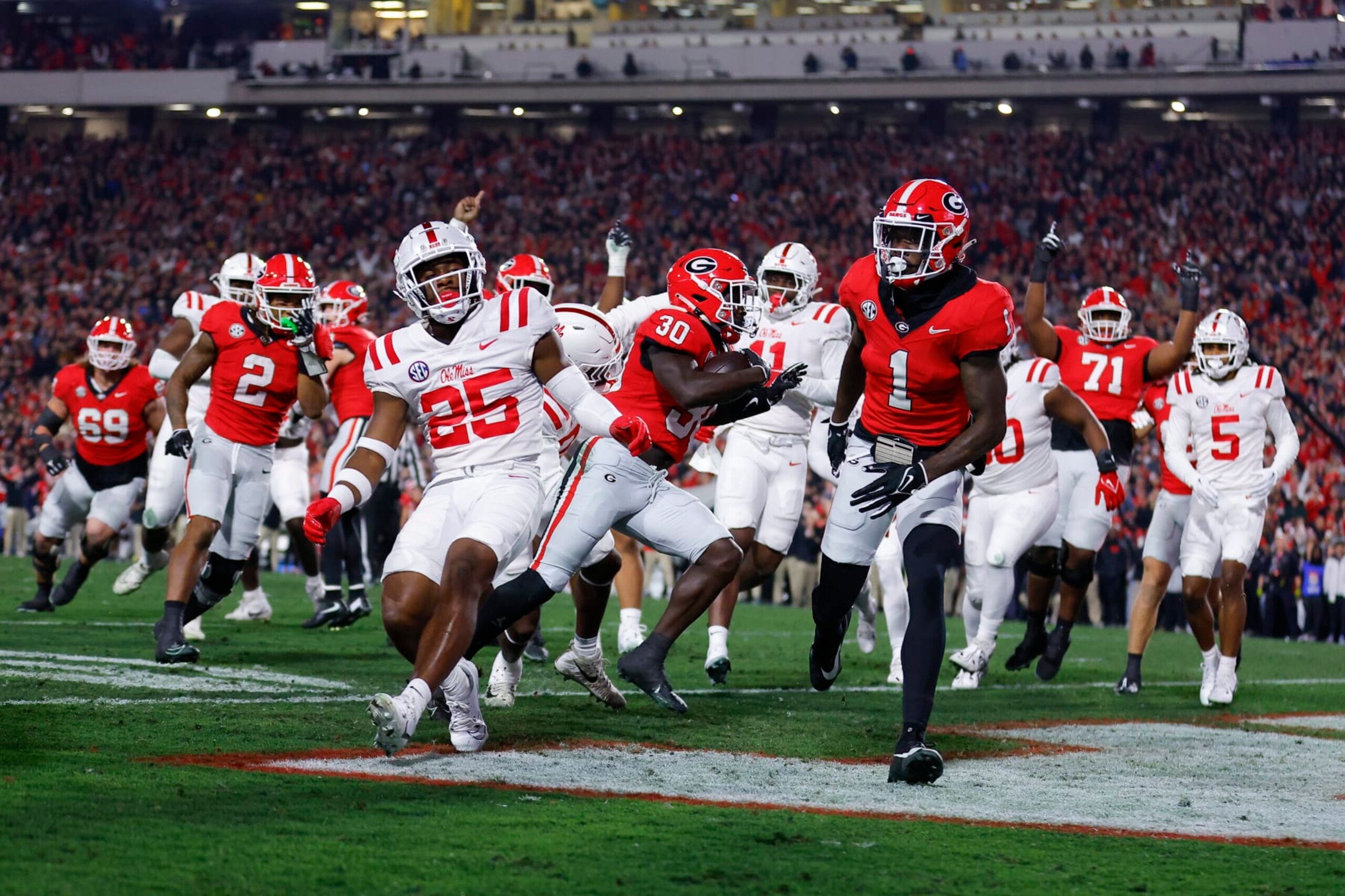 ATHENS, GEORGIA - NOVEMBER 11: Daijun Edwards #30 of the Georgia Bulldogs rushes in for a touchdown during the first quarter against the Mississippi Rebels at Sanford Stadium on November 11, 2023 in Athens, Georgia. (Photo by Todd Kirkland/Getty Images)