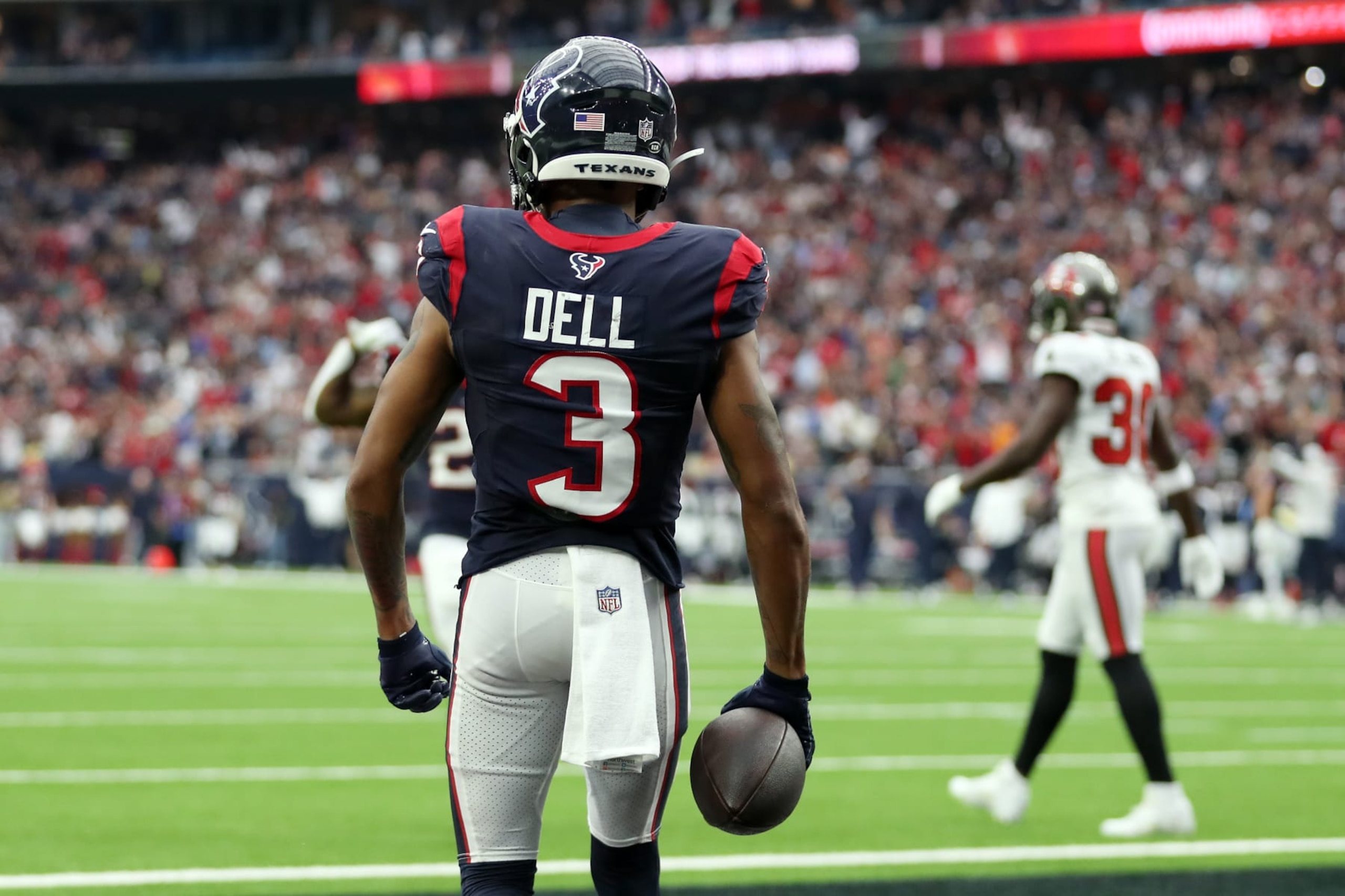 HOUSTON, TEXAS - NOVEMBER 05: Tank Dell #3 of the Houston Texans reacts after a touchdown in the third quarter of a game against the Tampa Bay Buccaneers at NRG Stadium on November 05, 2023 in Houston, Texas. (Photo by Tim Warner/Getty Images)