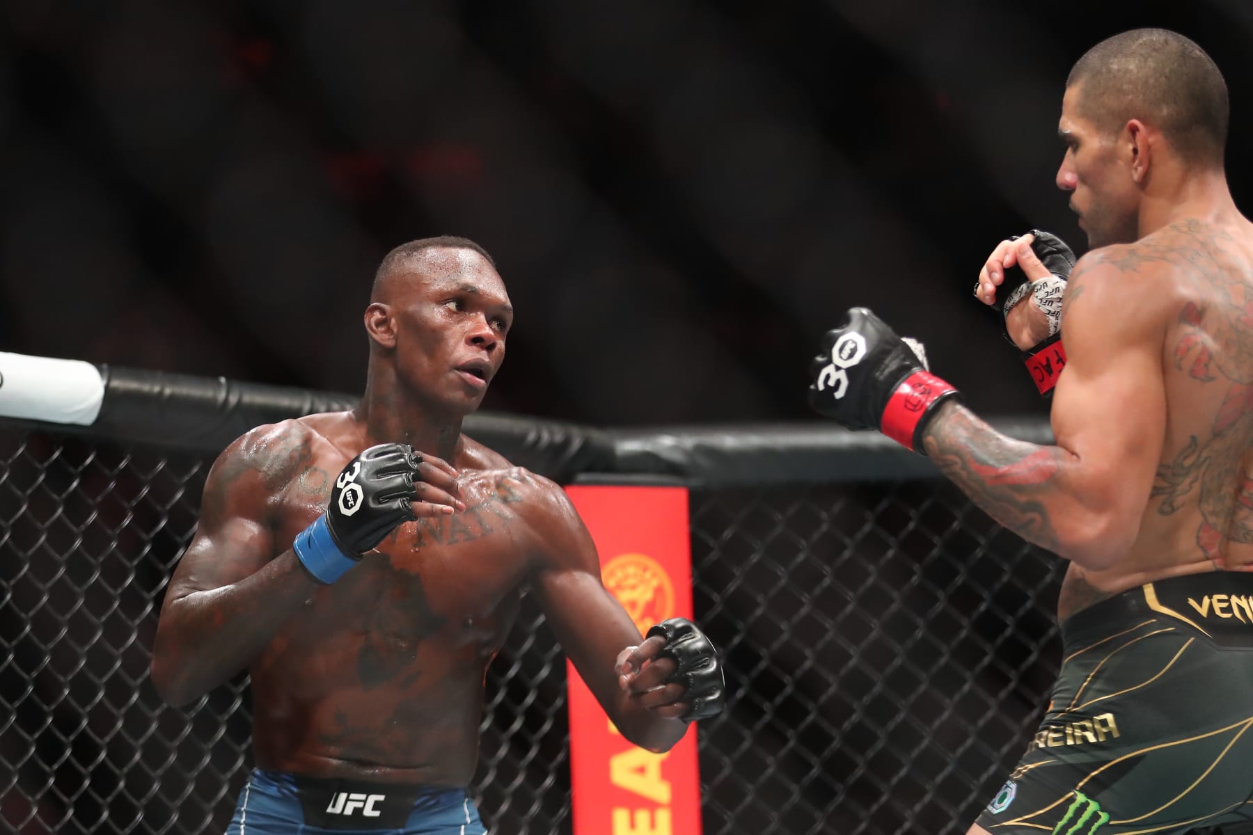 Israel Adesanya (left) squares of with Alex Pereira